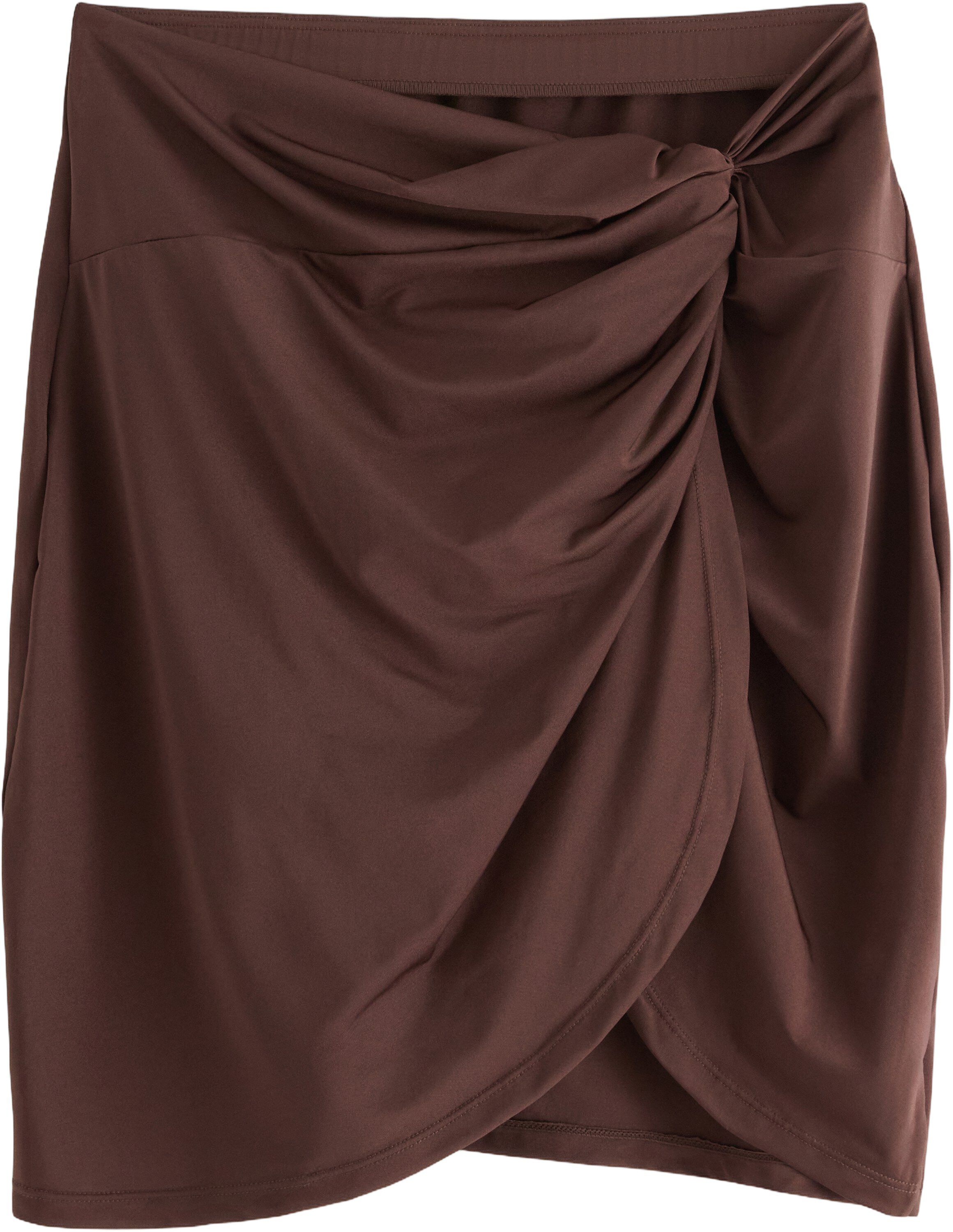 Badeskj&oslash;rt med vridet detalj foran.