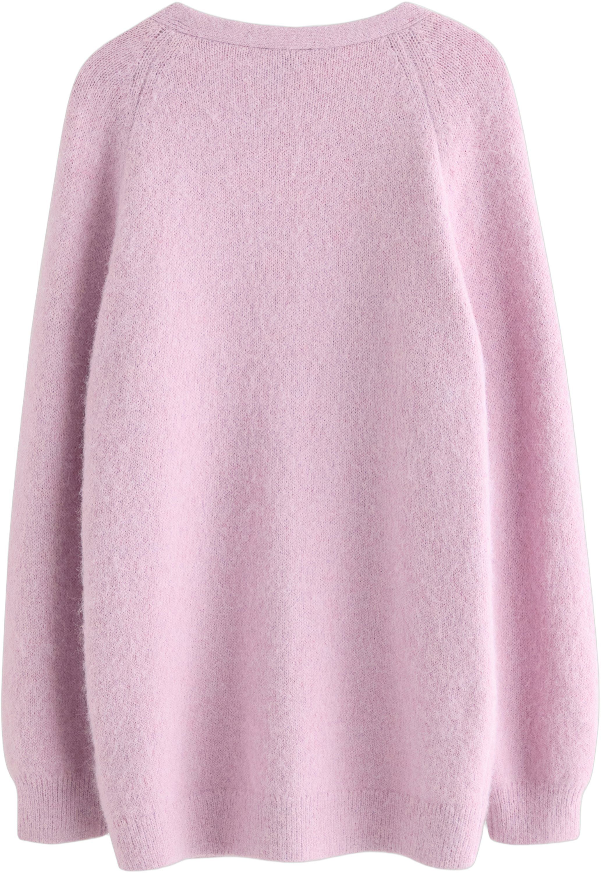 Knitted cardigan with a slightly lo