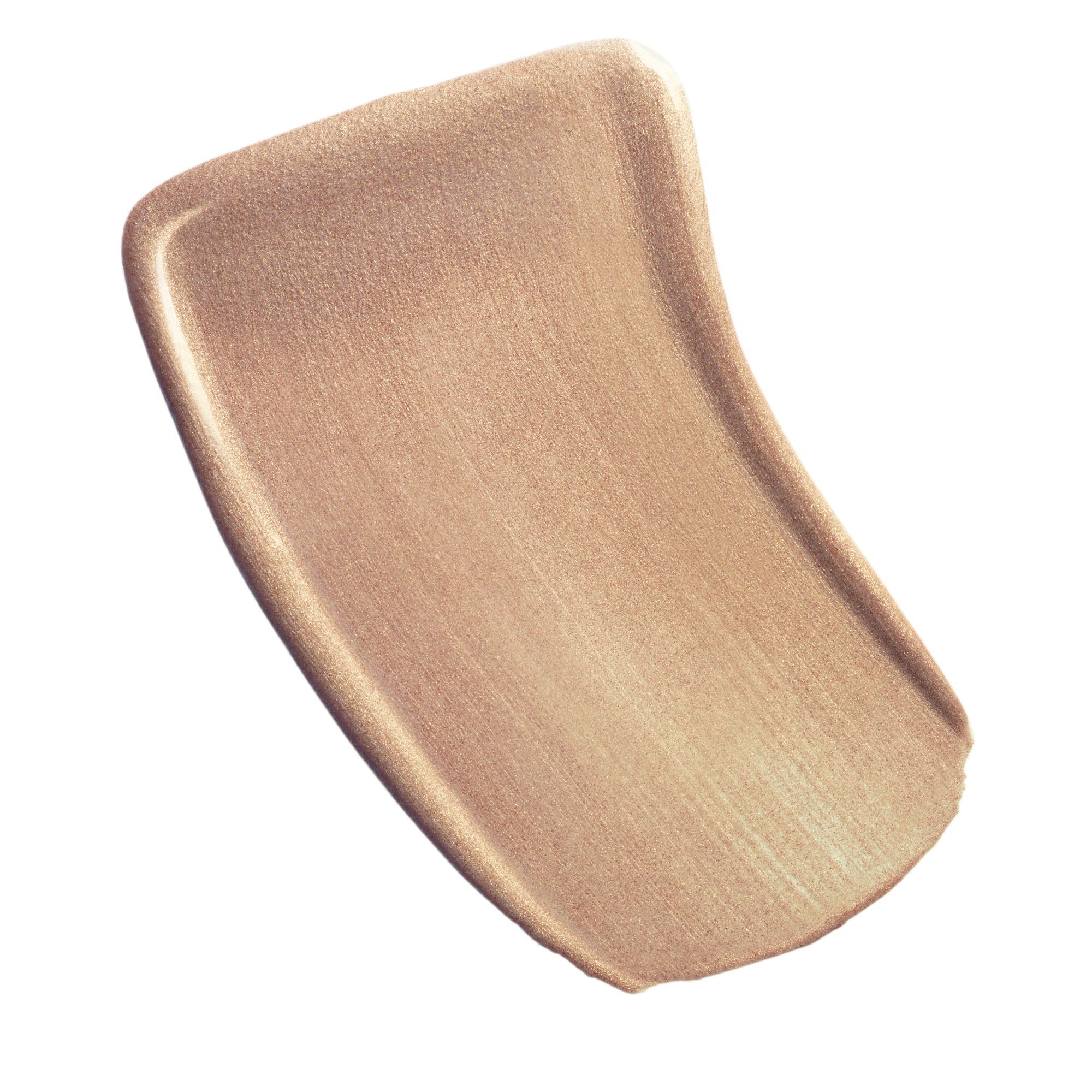 LET TRANSPARENT OG LYSGIVENDE FLUID MED IRISERENDE EFFEKT