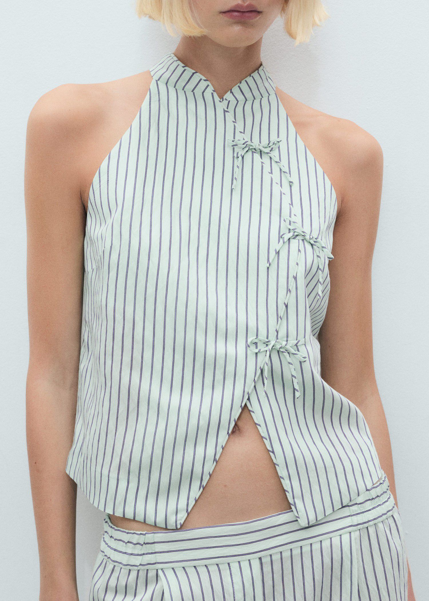 Striped top with a strap neckline a