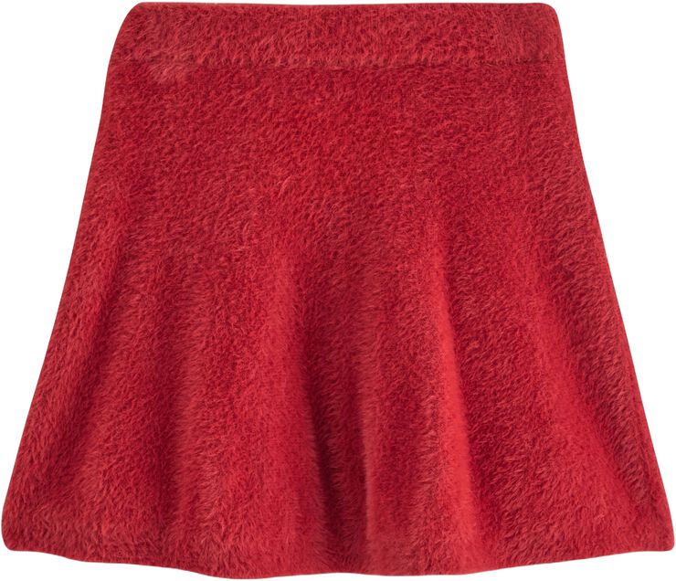 Mjukt utsvängd kjol i fjädergarn.