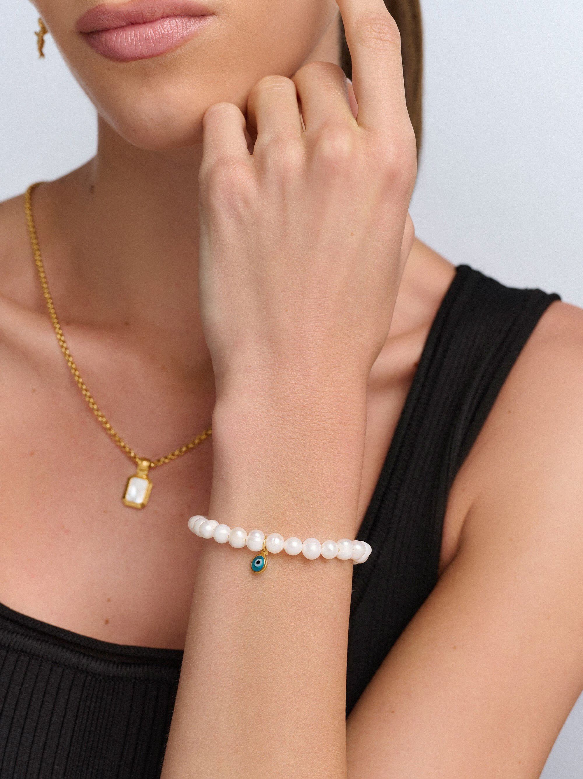 Women's Wristband with White Pearls and Blue Evil Eye Charm