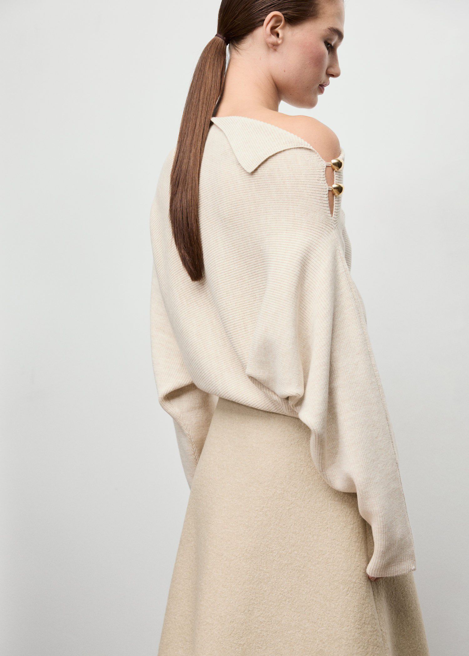 Sweater with asymmetrical neck and