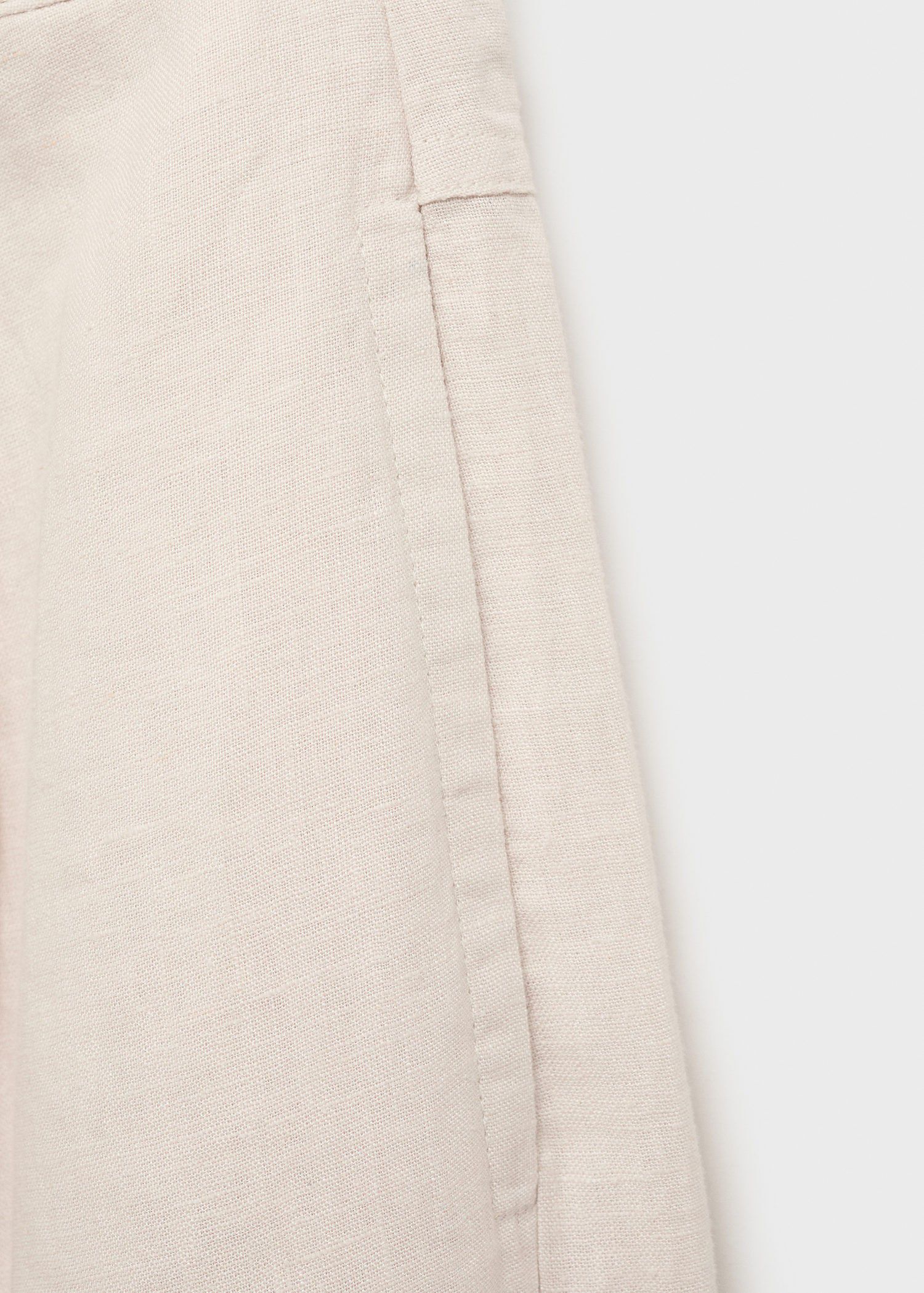 Linen trousers with tortoiseshell b