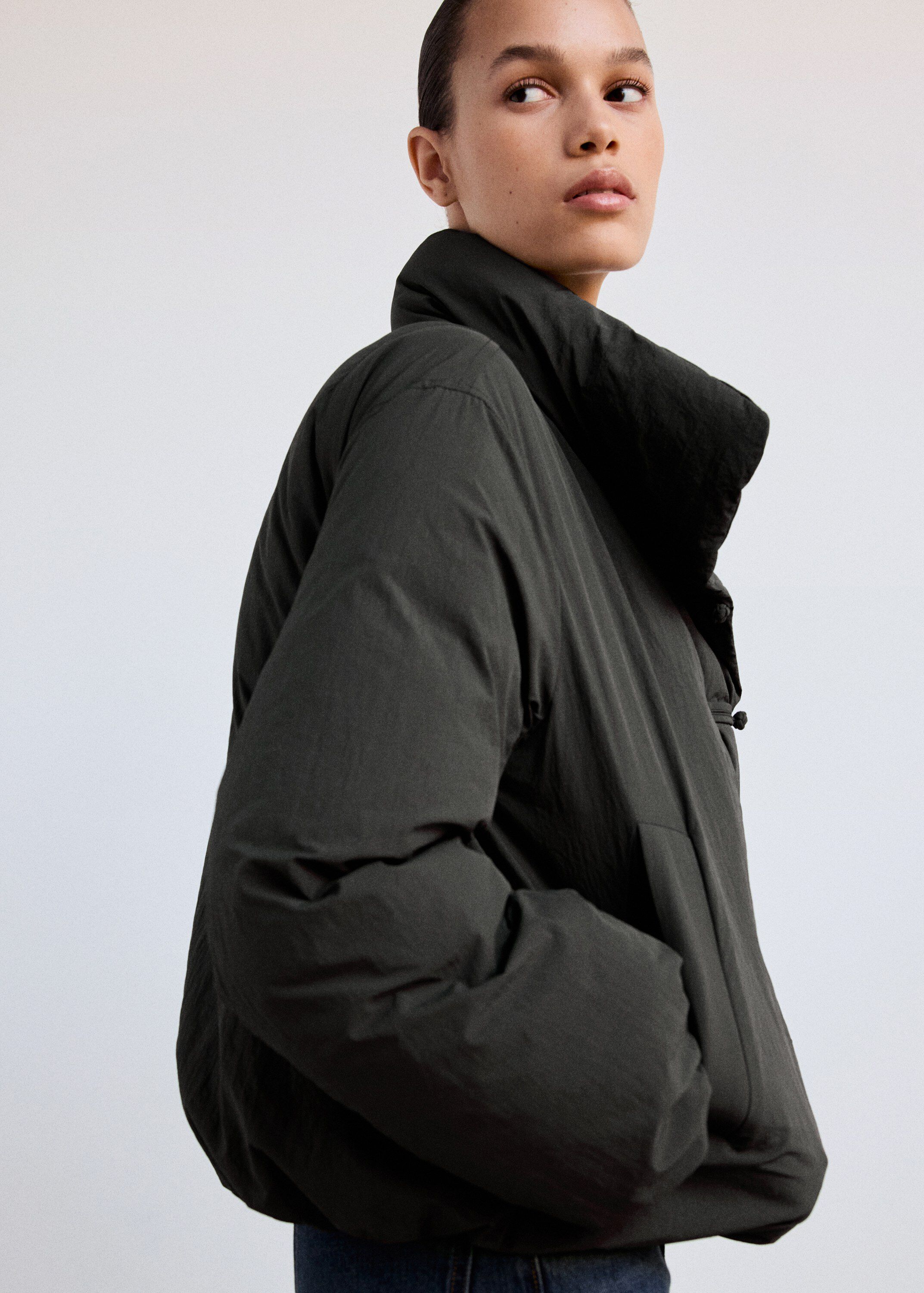 Padded anorak with toggle fastening
