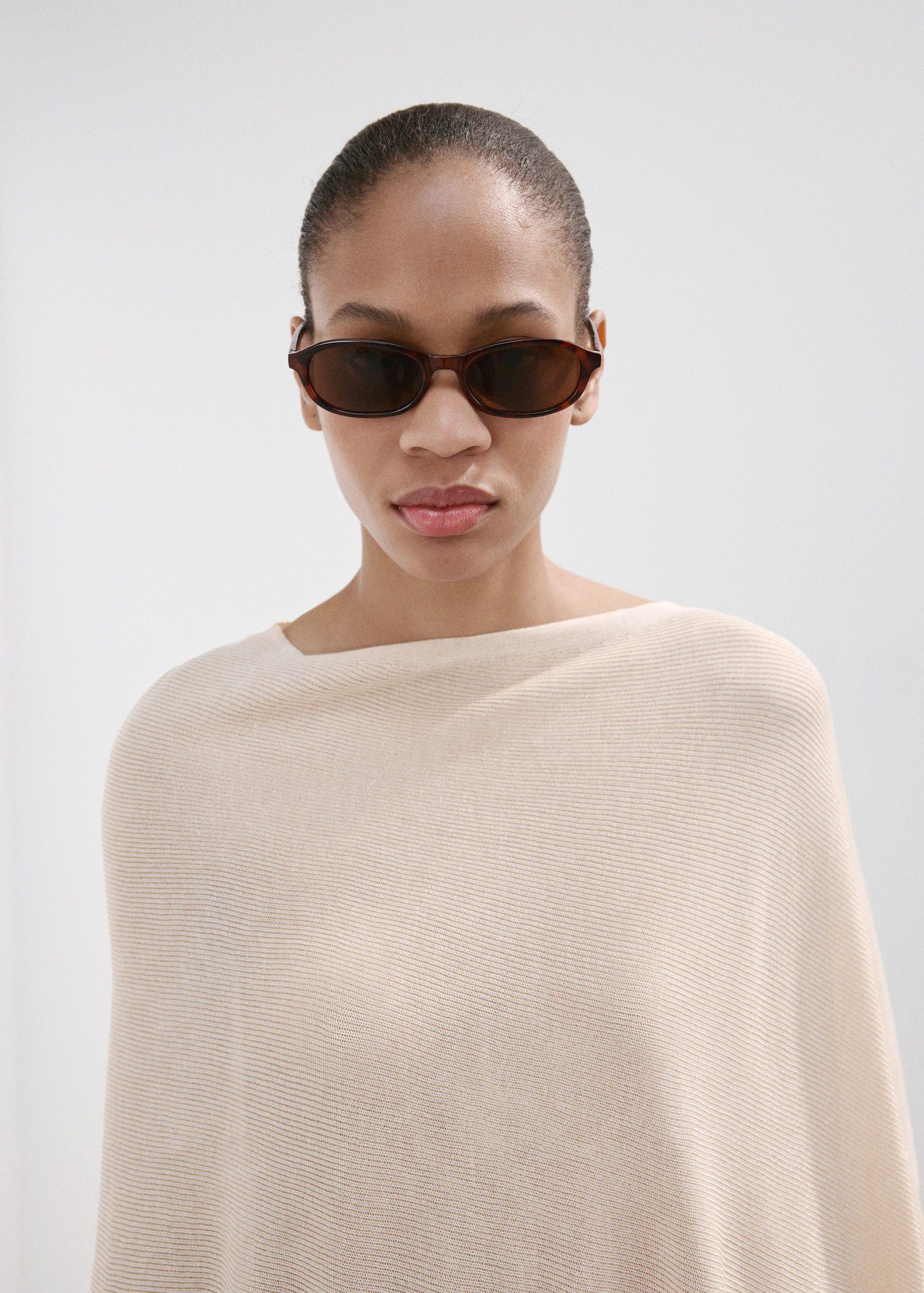 Asymmetrical knitted cape