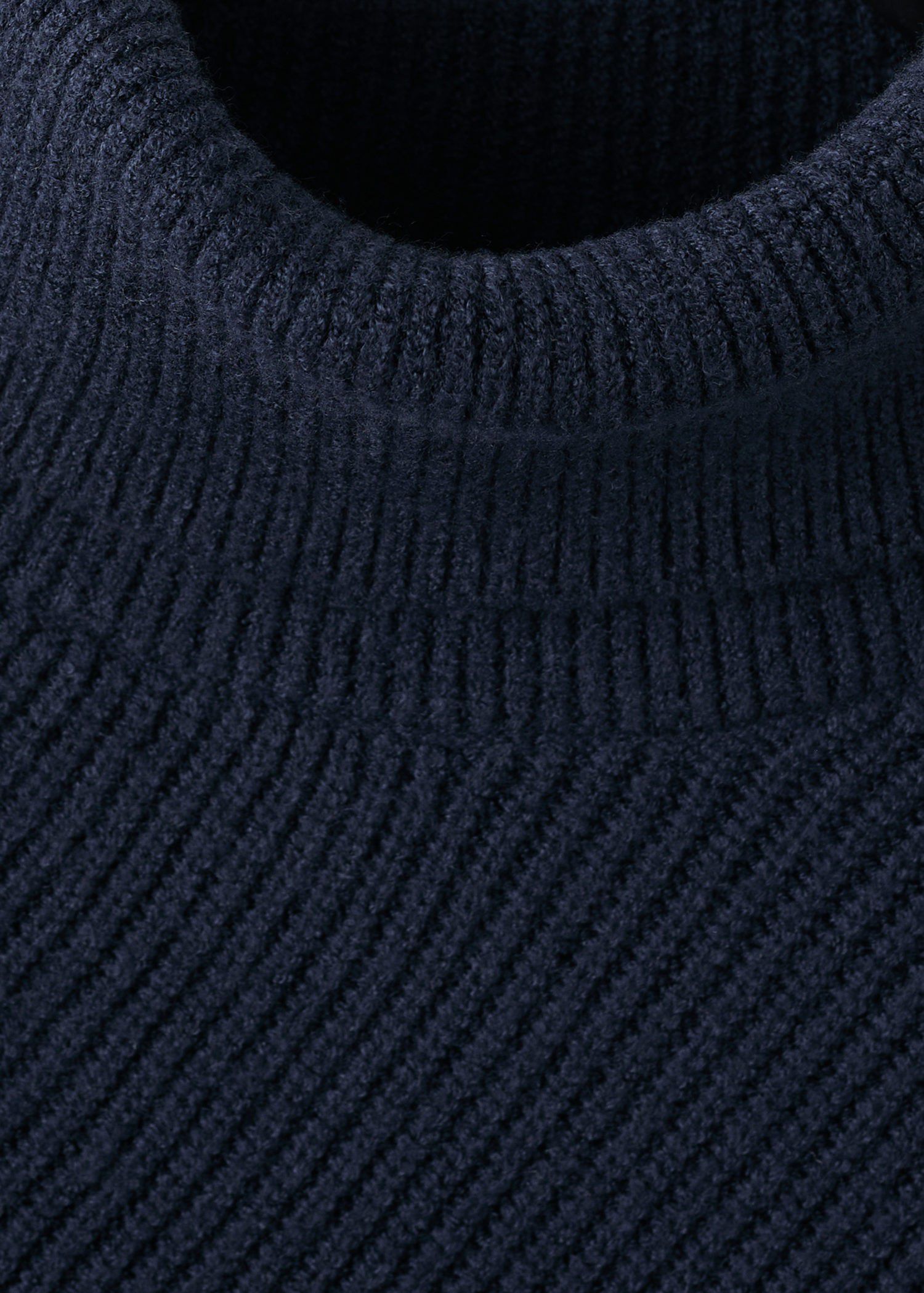 Sweater with asymmetrical roll neck