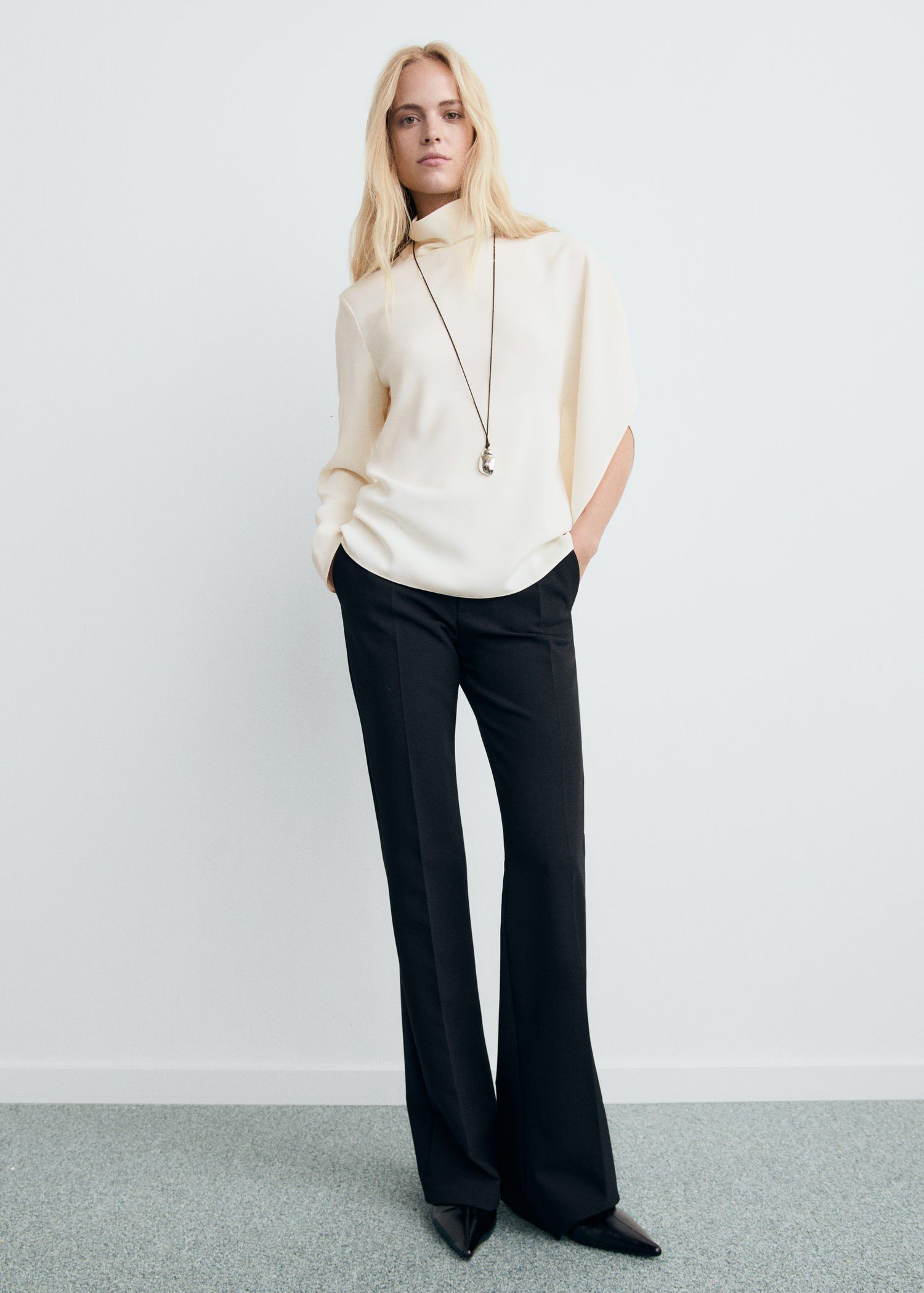 High-neck blouse with asymmetrical