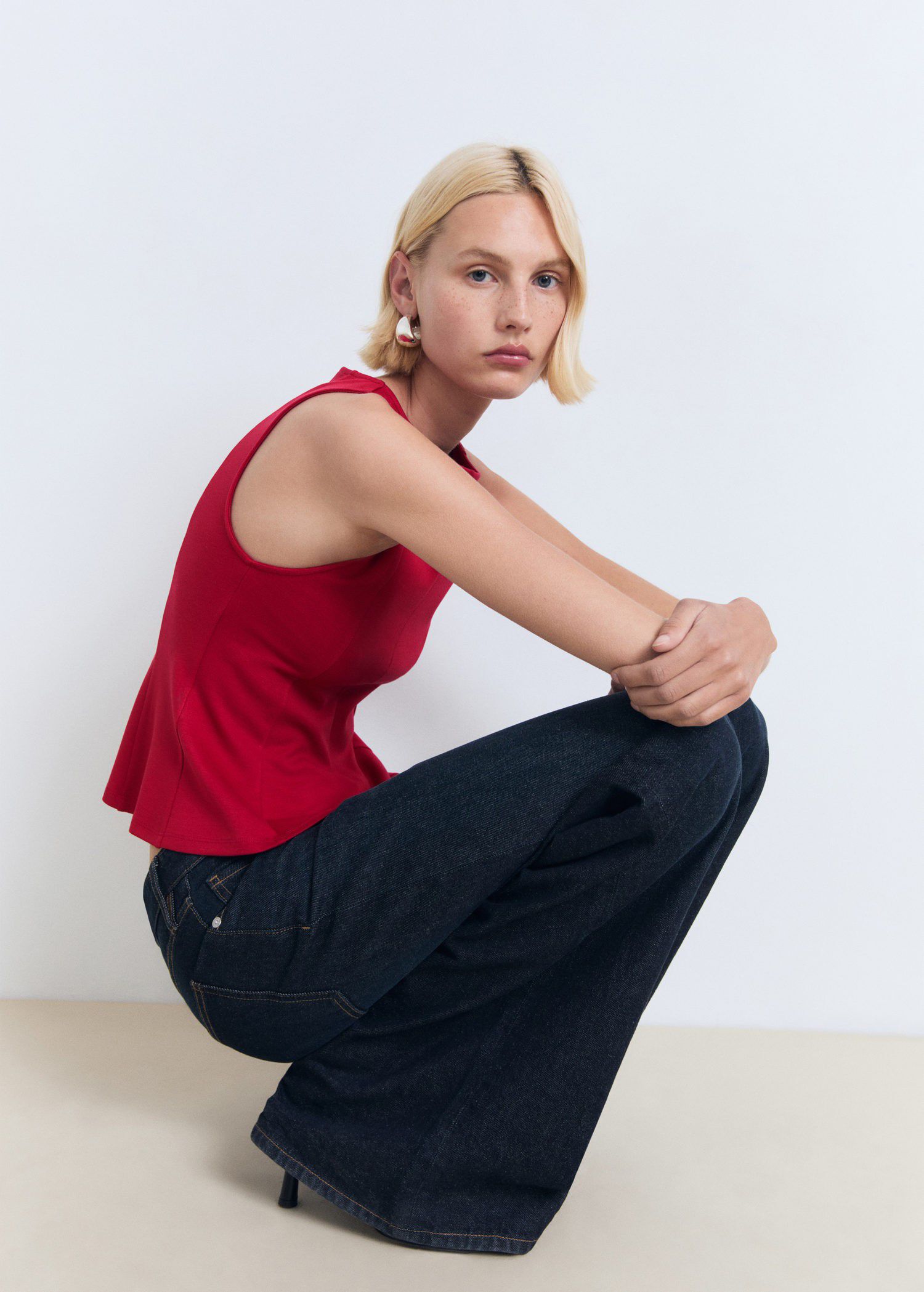 Peplum top with seam detail