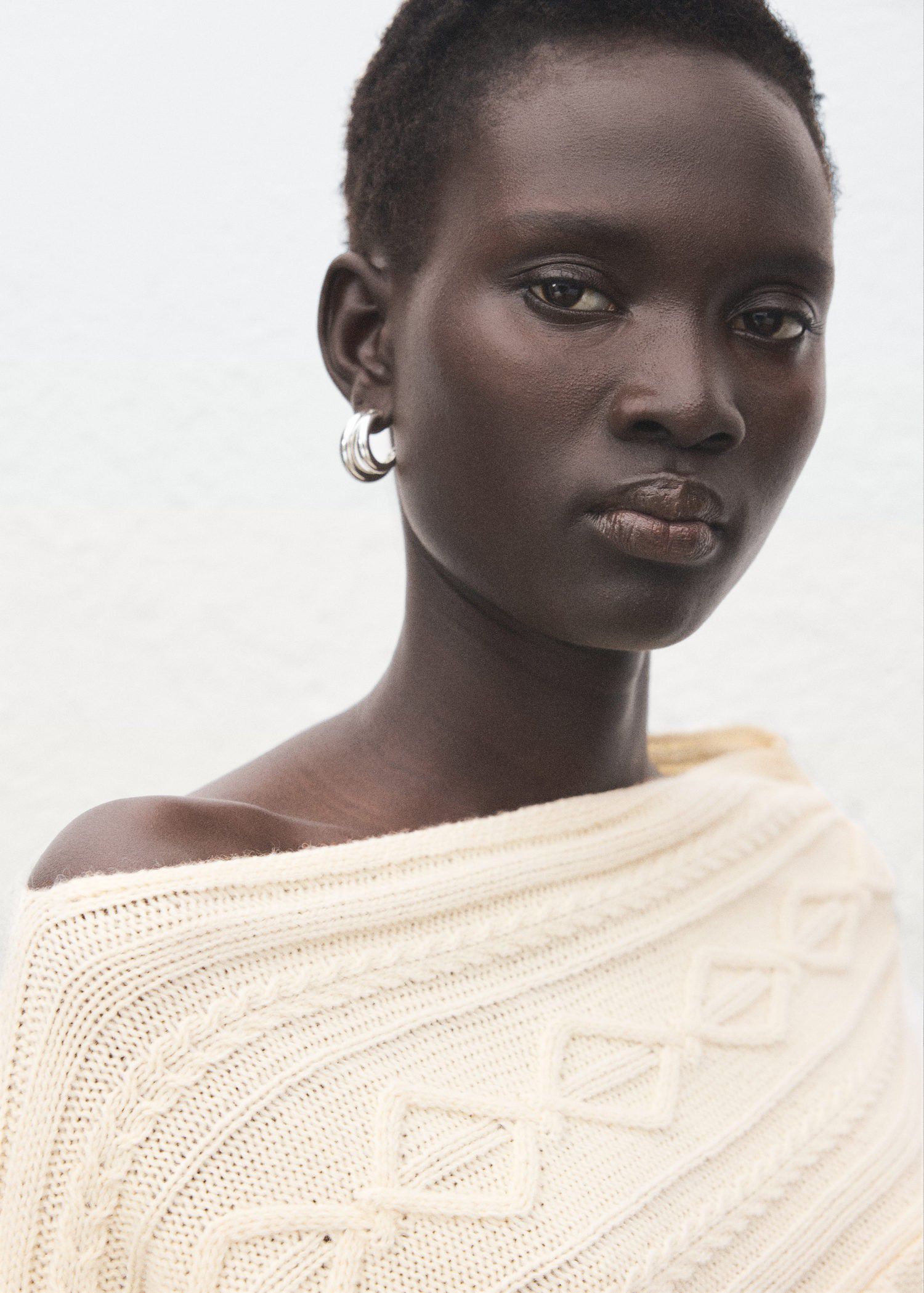 Asymmetrical cable knit sweater