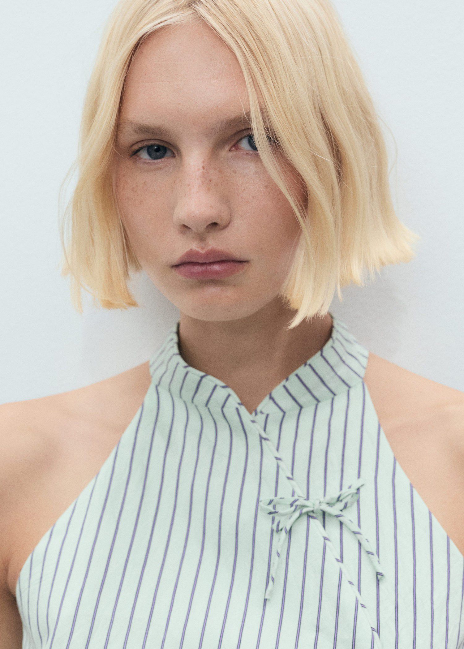 Striped top with a strap neckline a