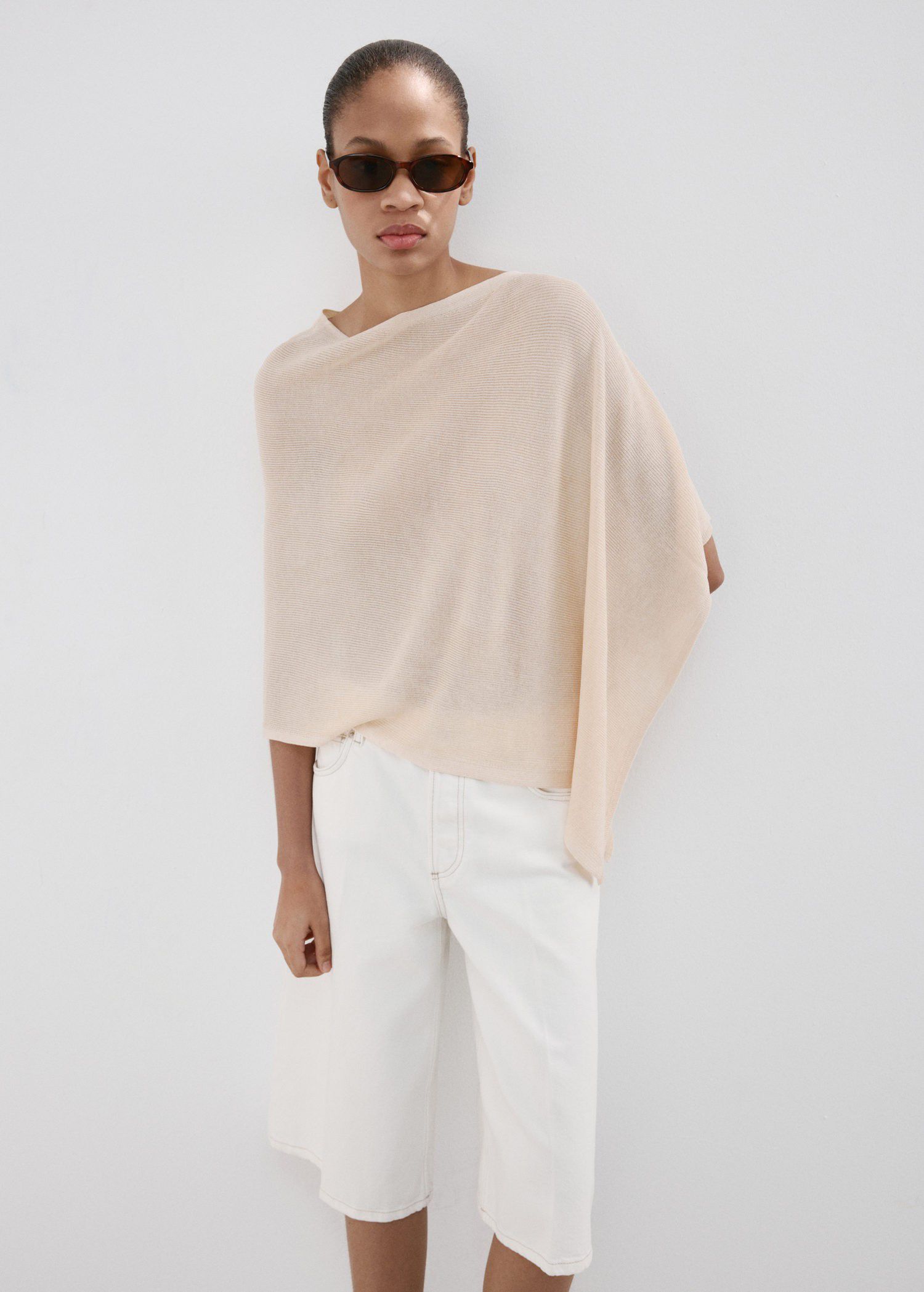 Asymmetrical knitted cape