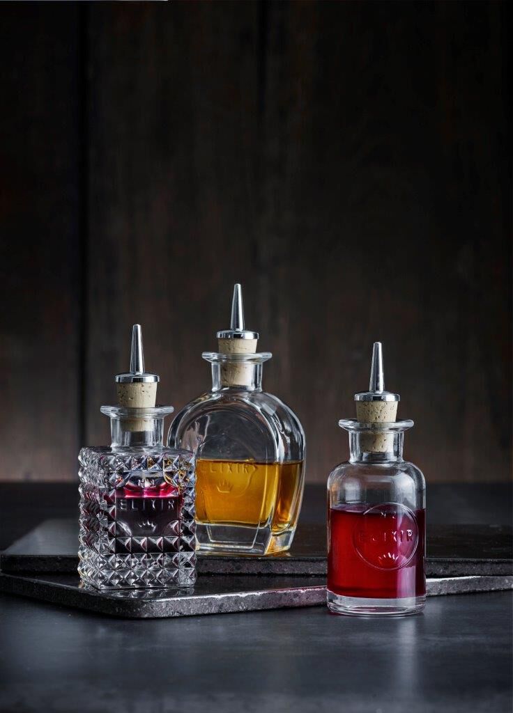 Elixir No1 flaske med sk&aelig;nkeprop kvadrat 10 cl.