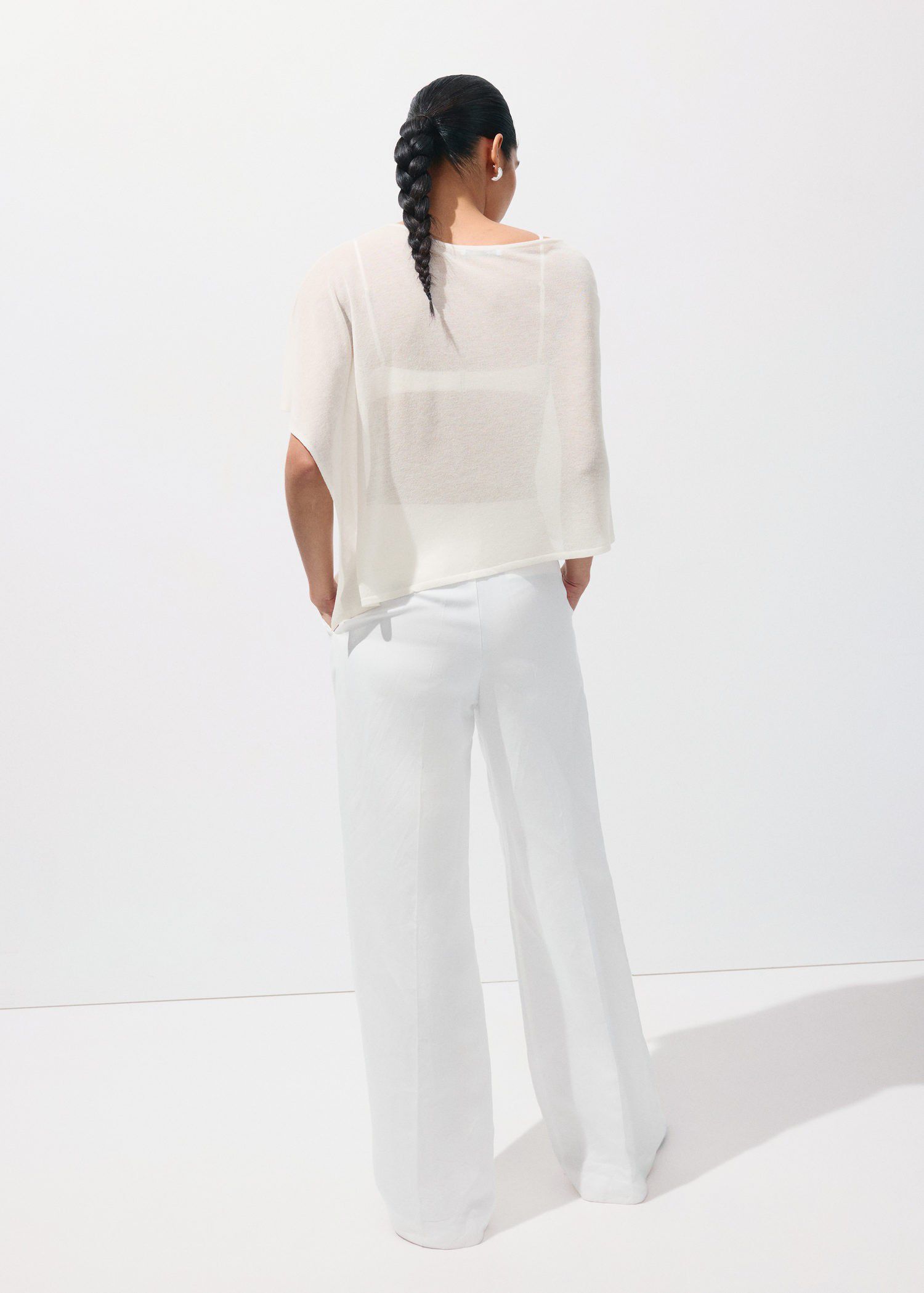 Asymmetrical knitted cape