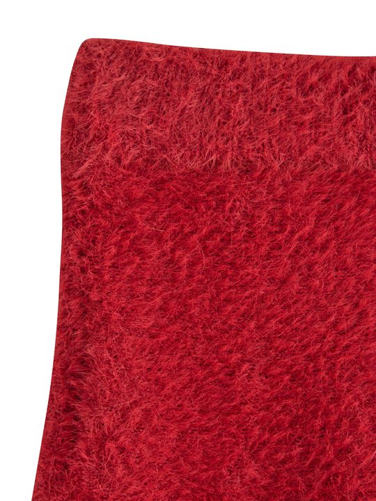 Mjukt utsvängd kjol i fjädergarn.