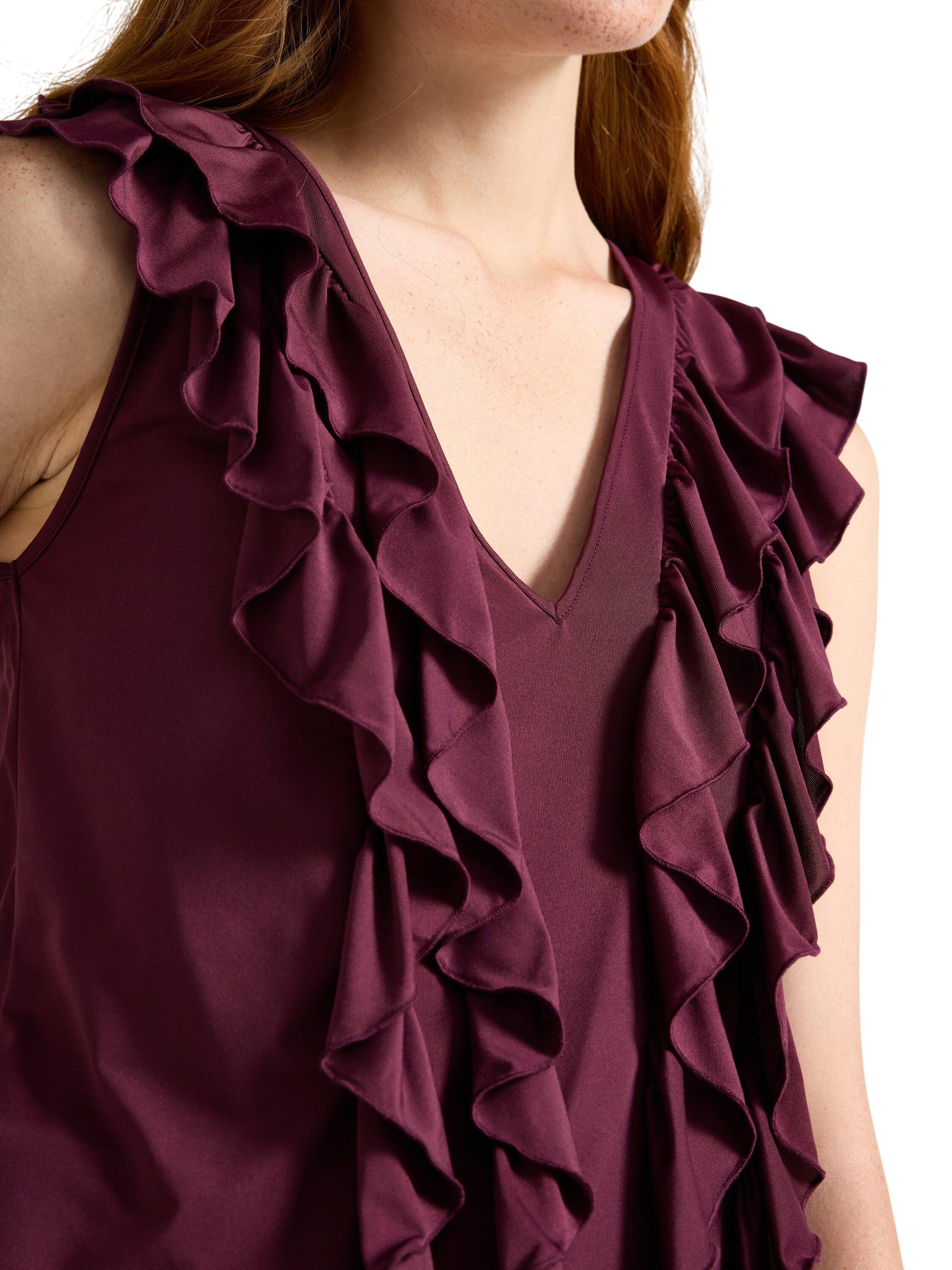 �rml&ouml;s topp i mjuk trik&aring; med vol