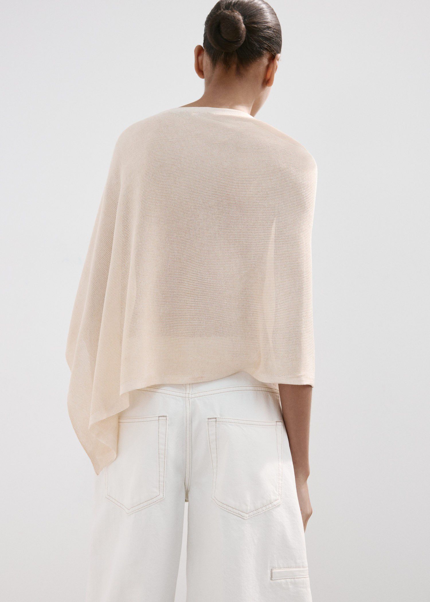 Asymmetrical knitted cape