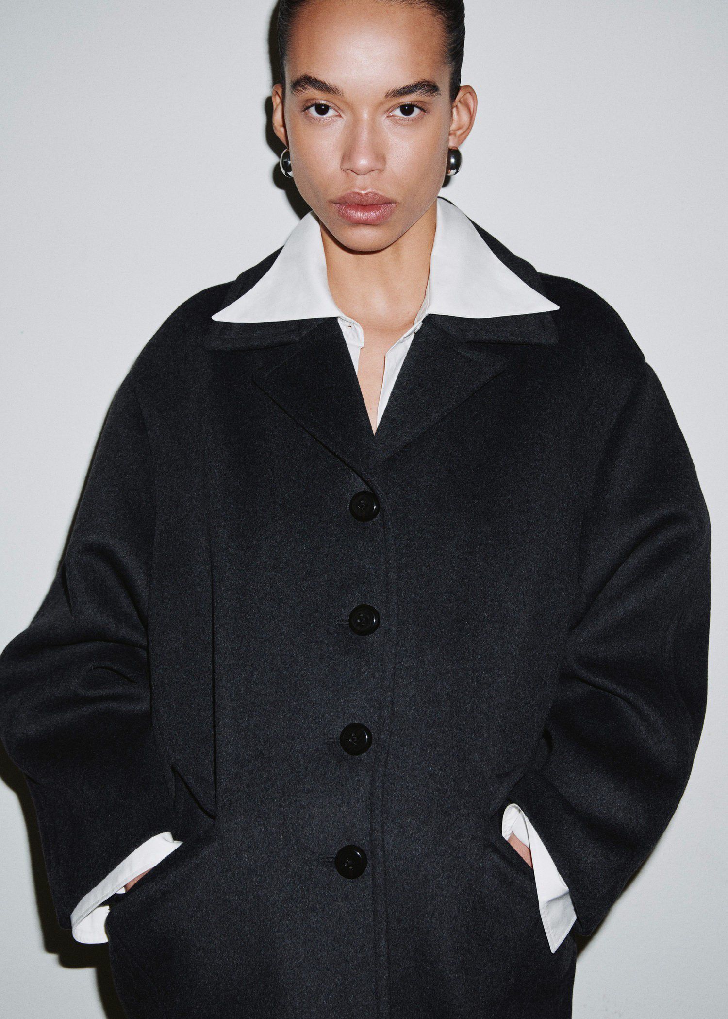 Wool-blend coat with button fasteni