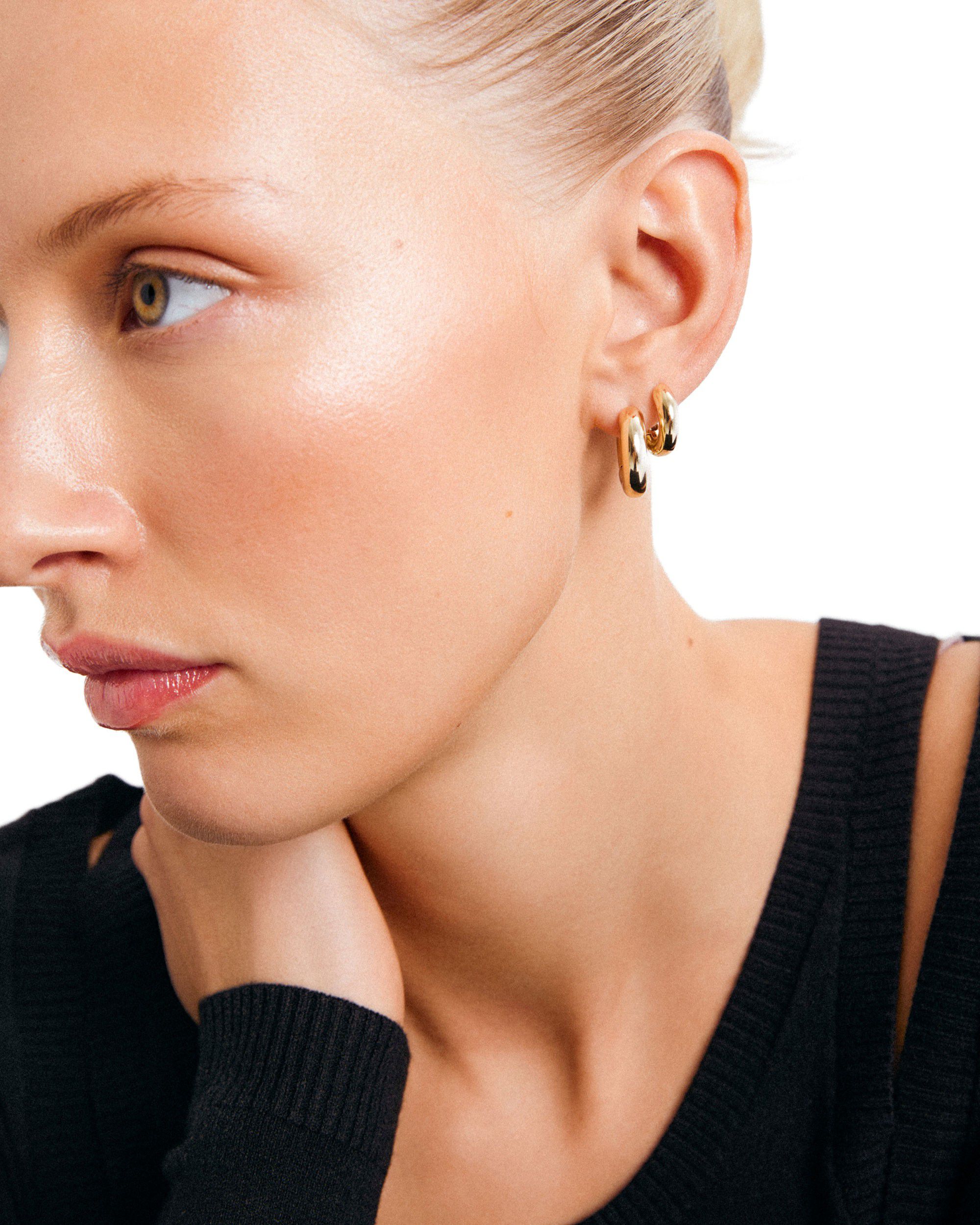 AICA chunky huggie hoop earrings gold-plated