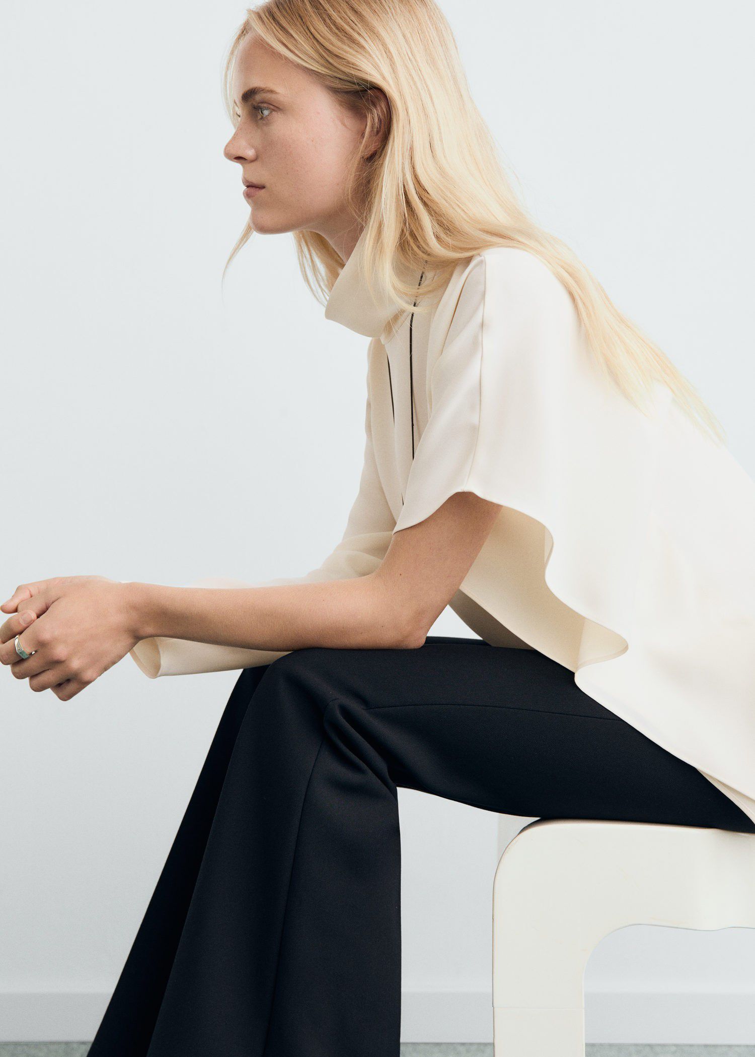 High-neck blouse with asymmetrical