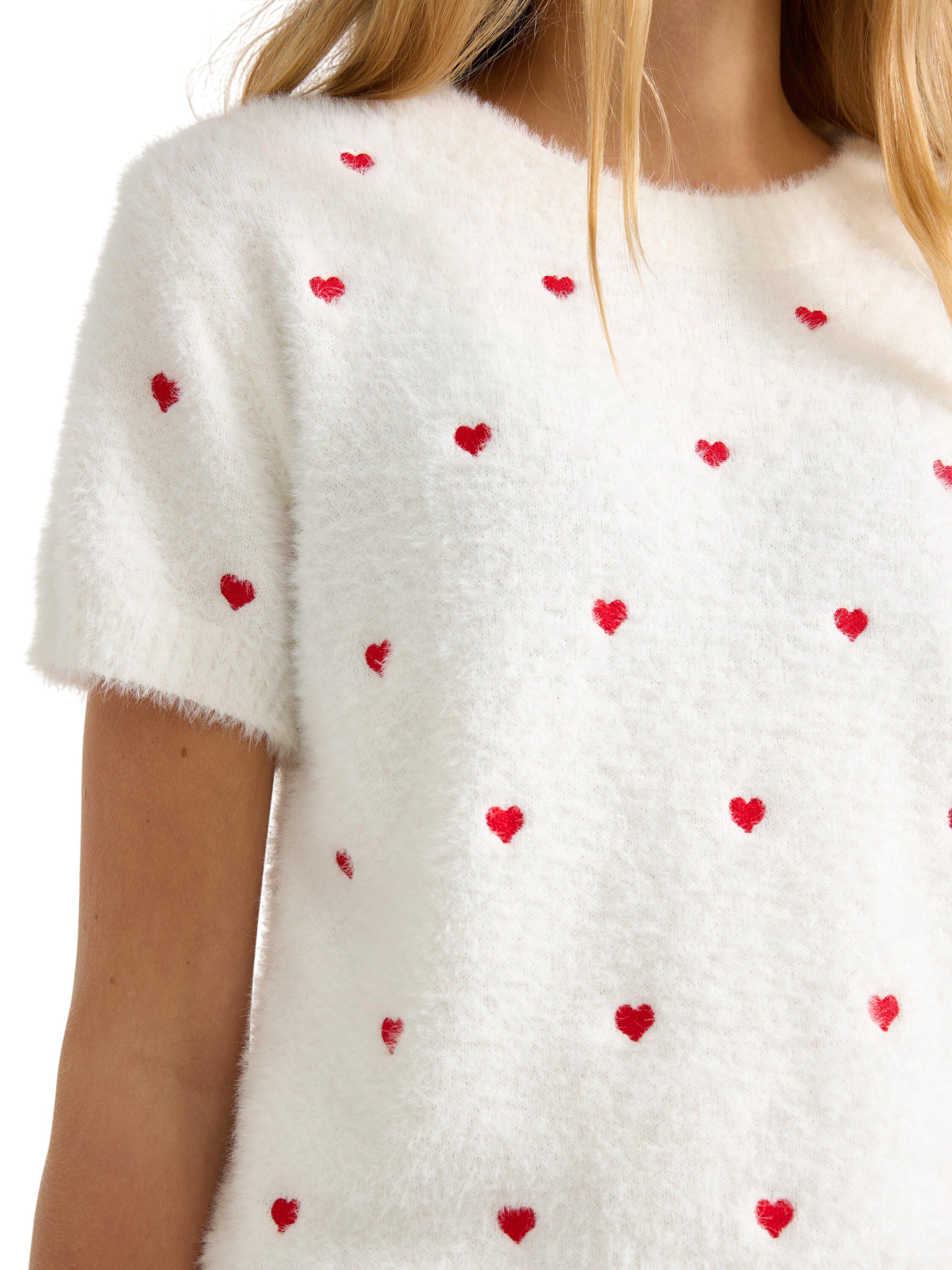 Kort&aelig;rmet strikket top i bl&oslash;dt fjer