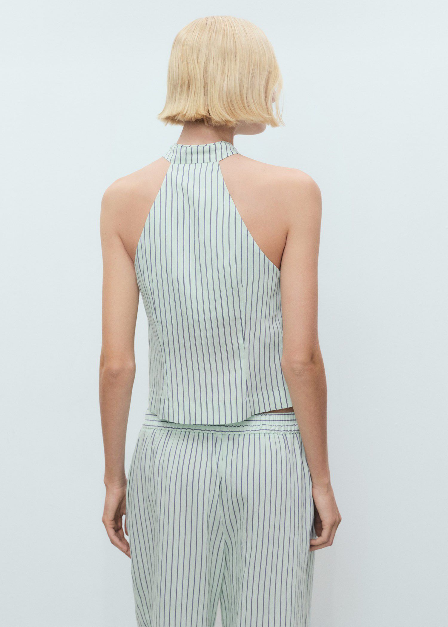 Striped top with a strap neckline a