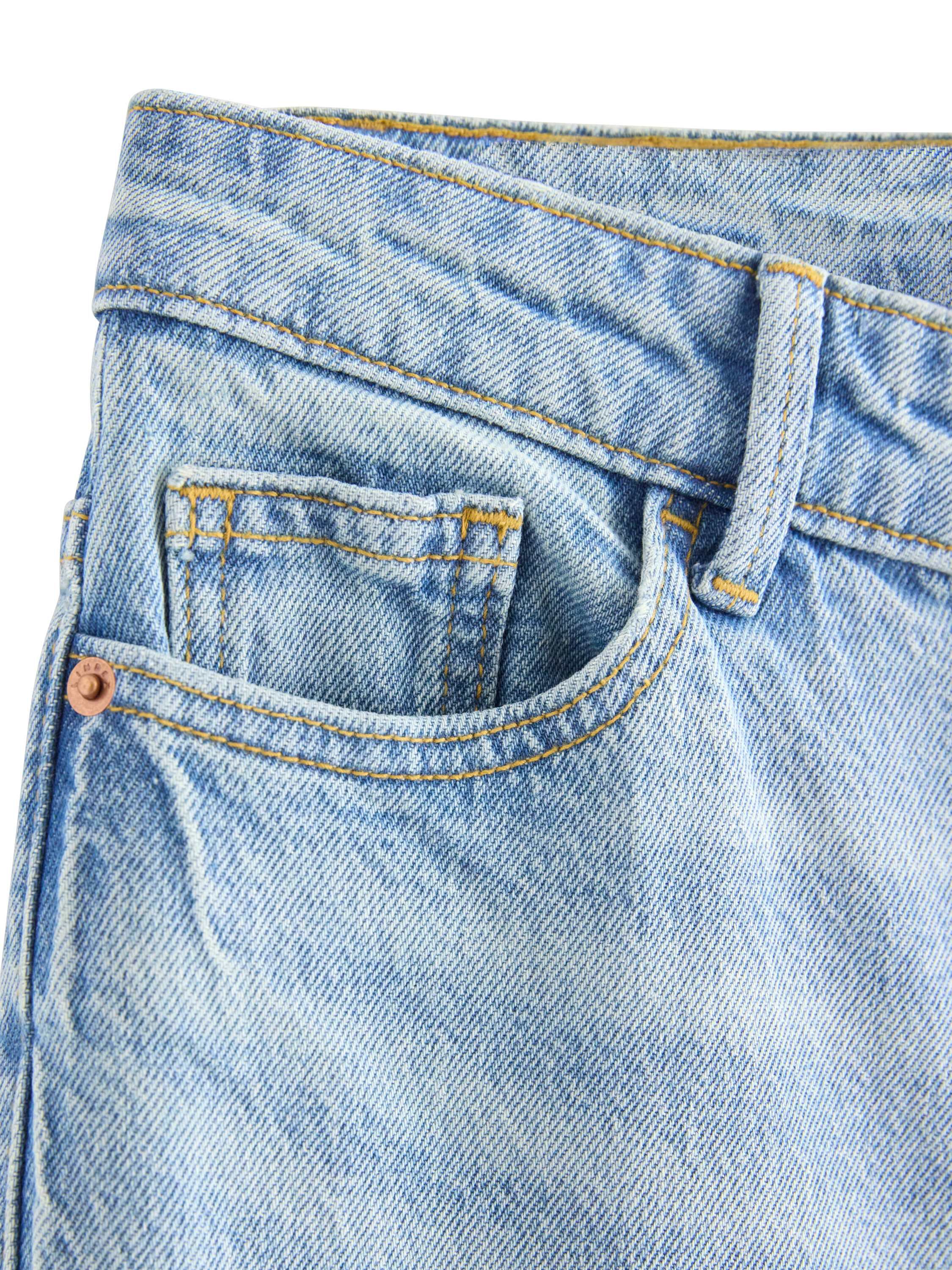 H&oslash;jtaljede jeans i bomuldsdenim med