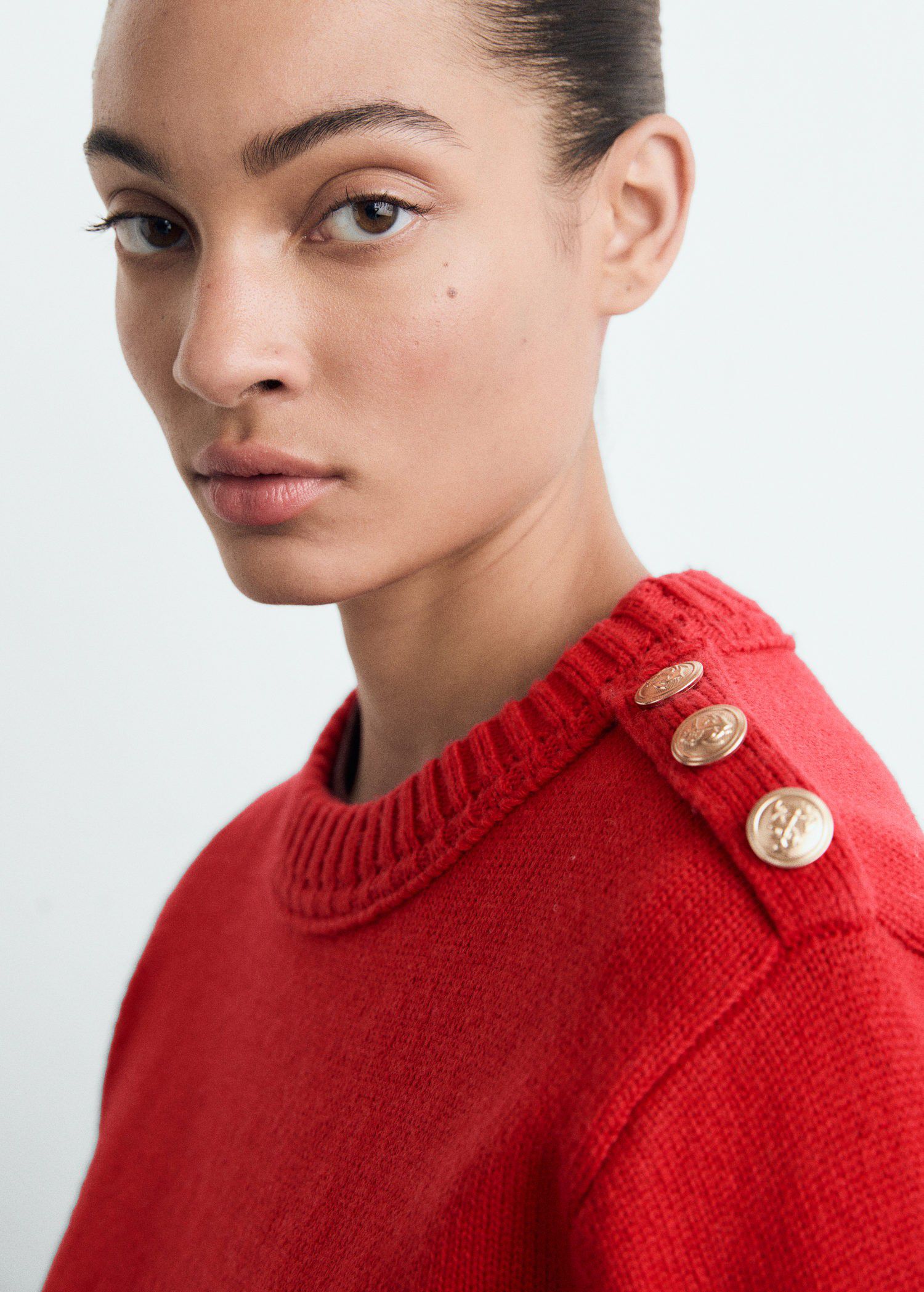 Knitted sweater with jewel buttons