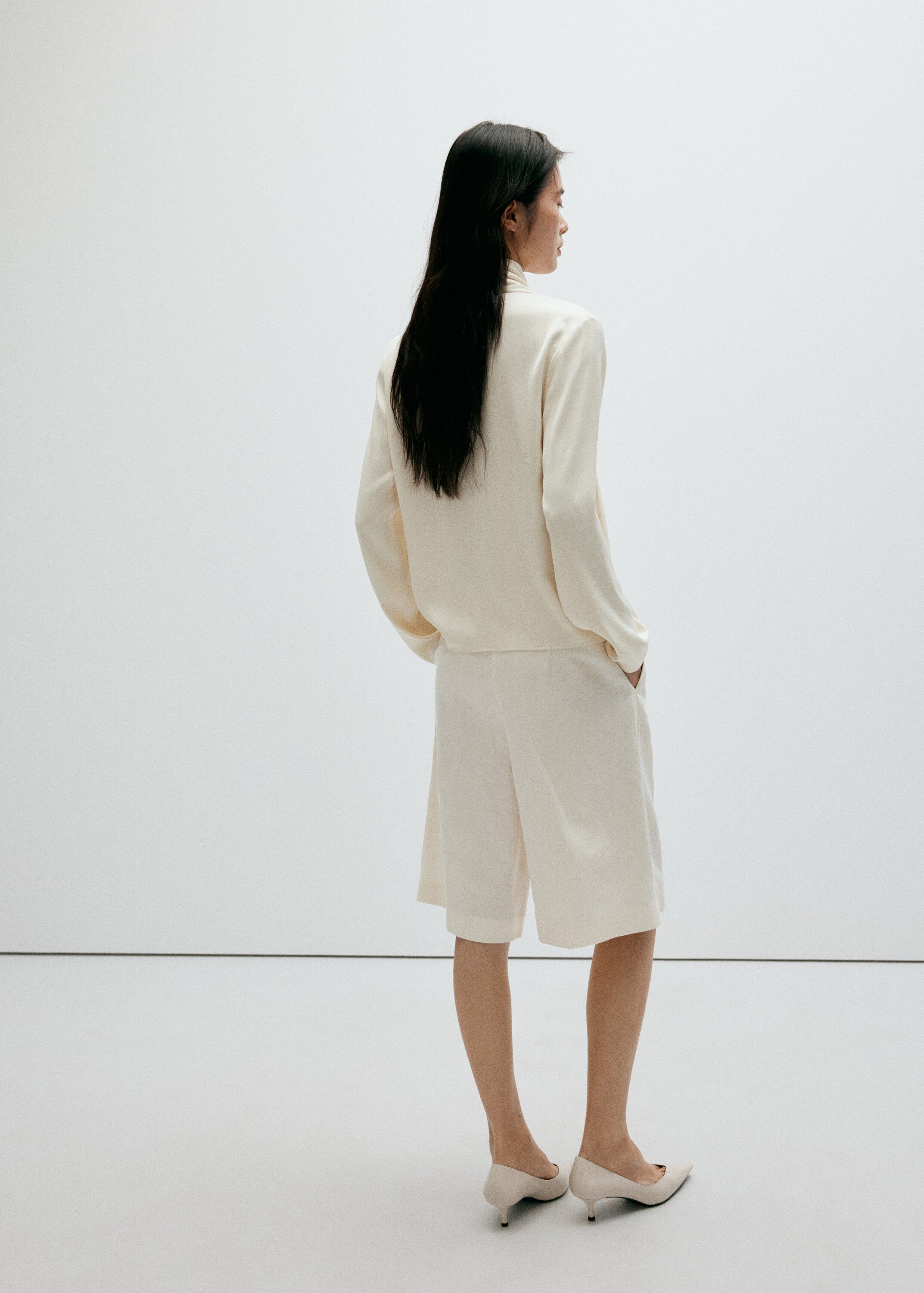 High-neck blouse with scarf detail