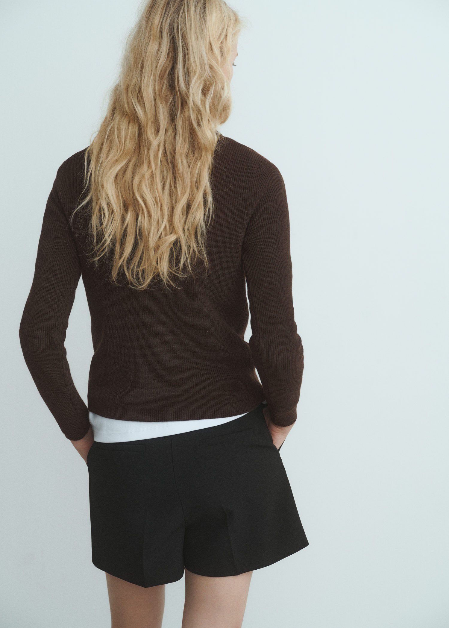 Sweater with asymmetrical neck and