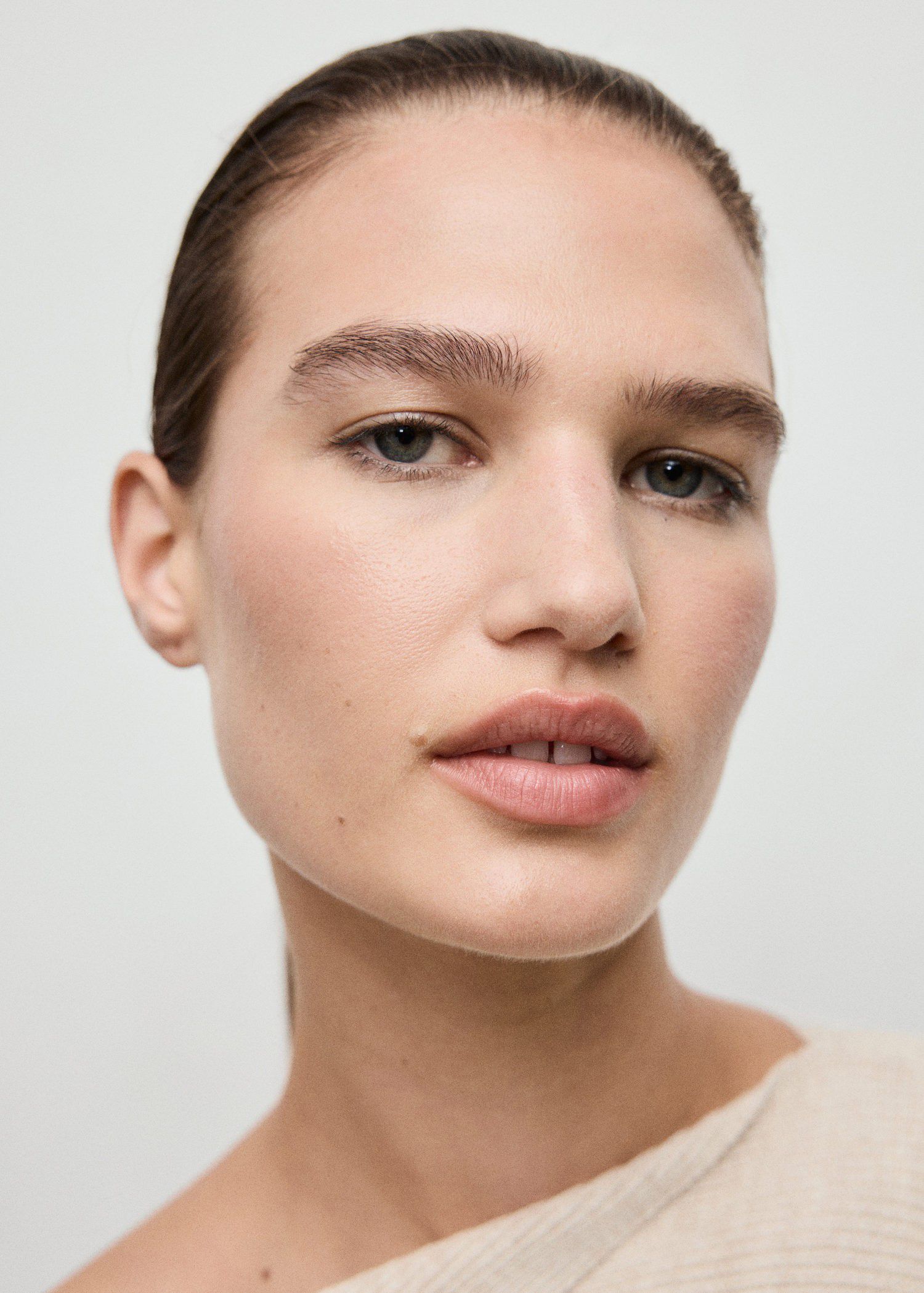 Sweater with asymmetrical neck and