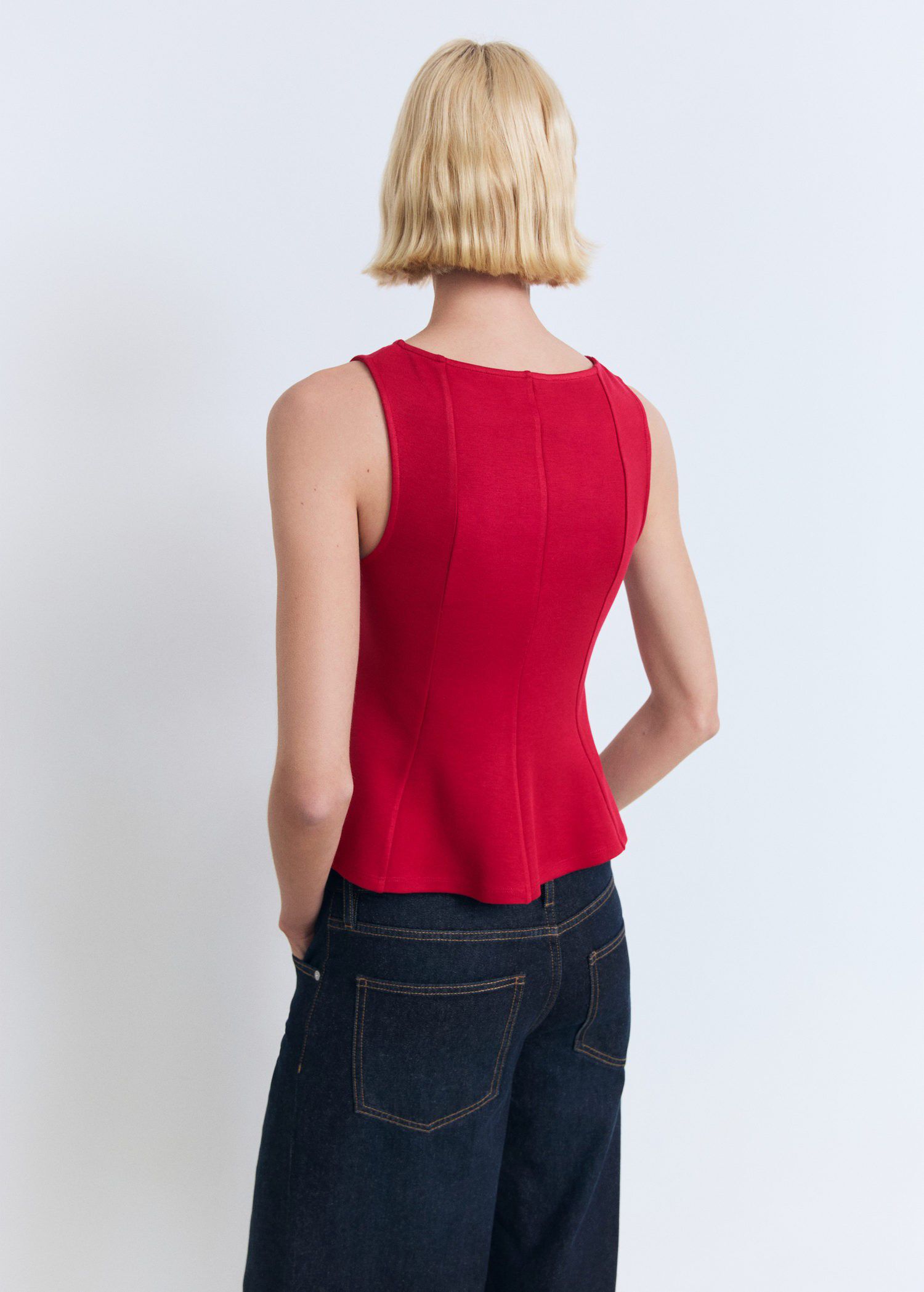 Peplum top with seam detail