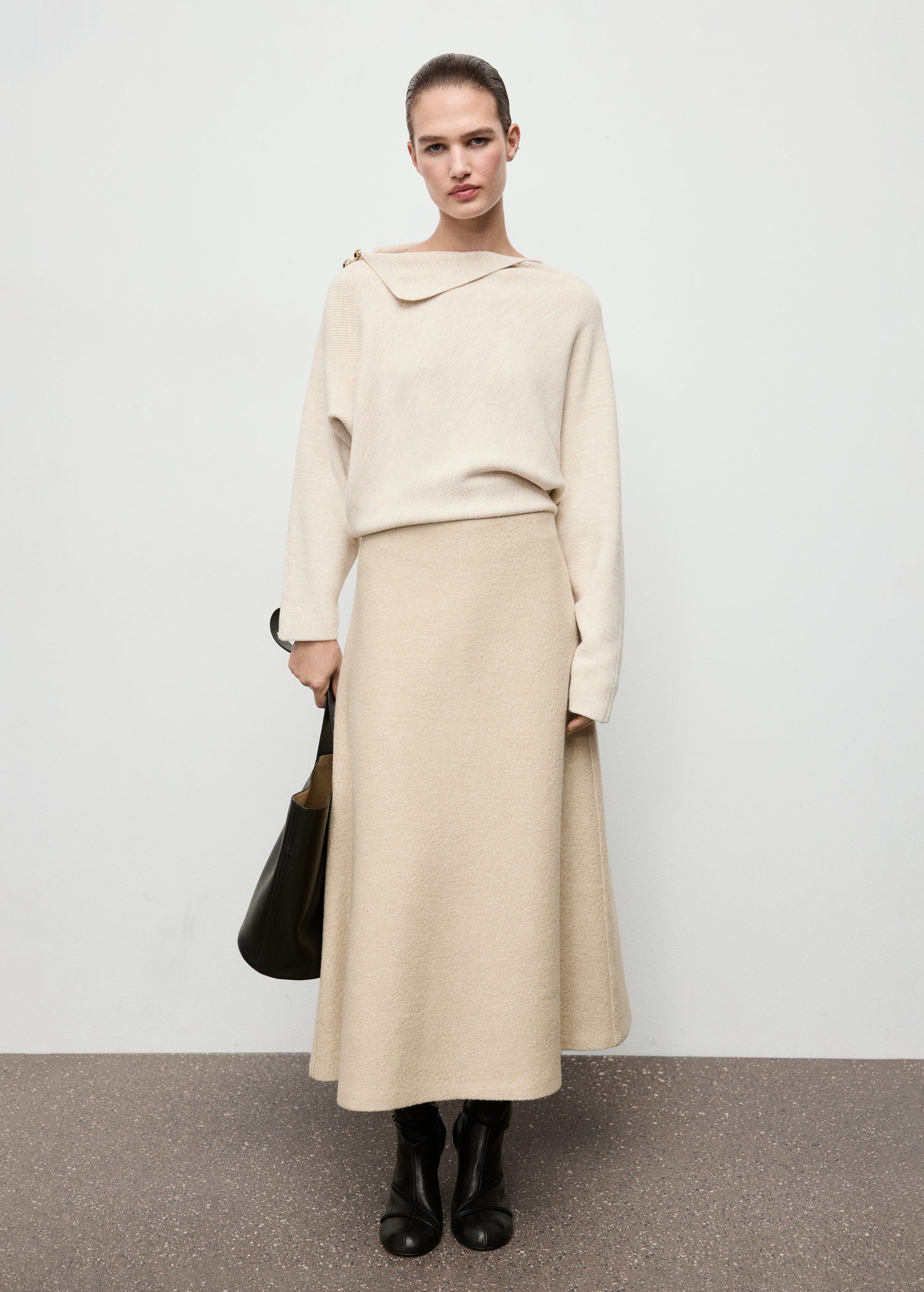 Sweater with asymmetrical neck and