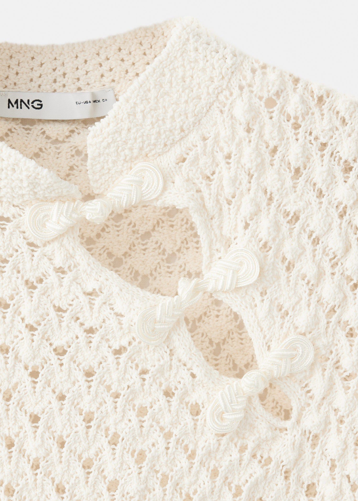 Openwork knit sweater with toggle c