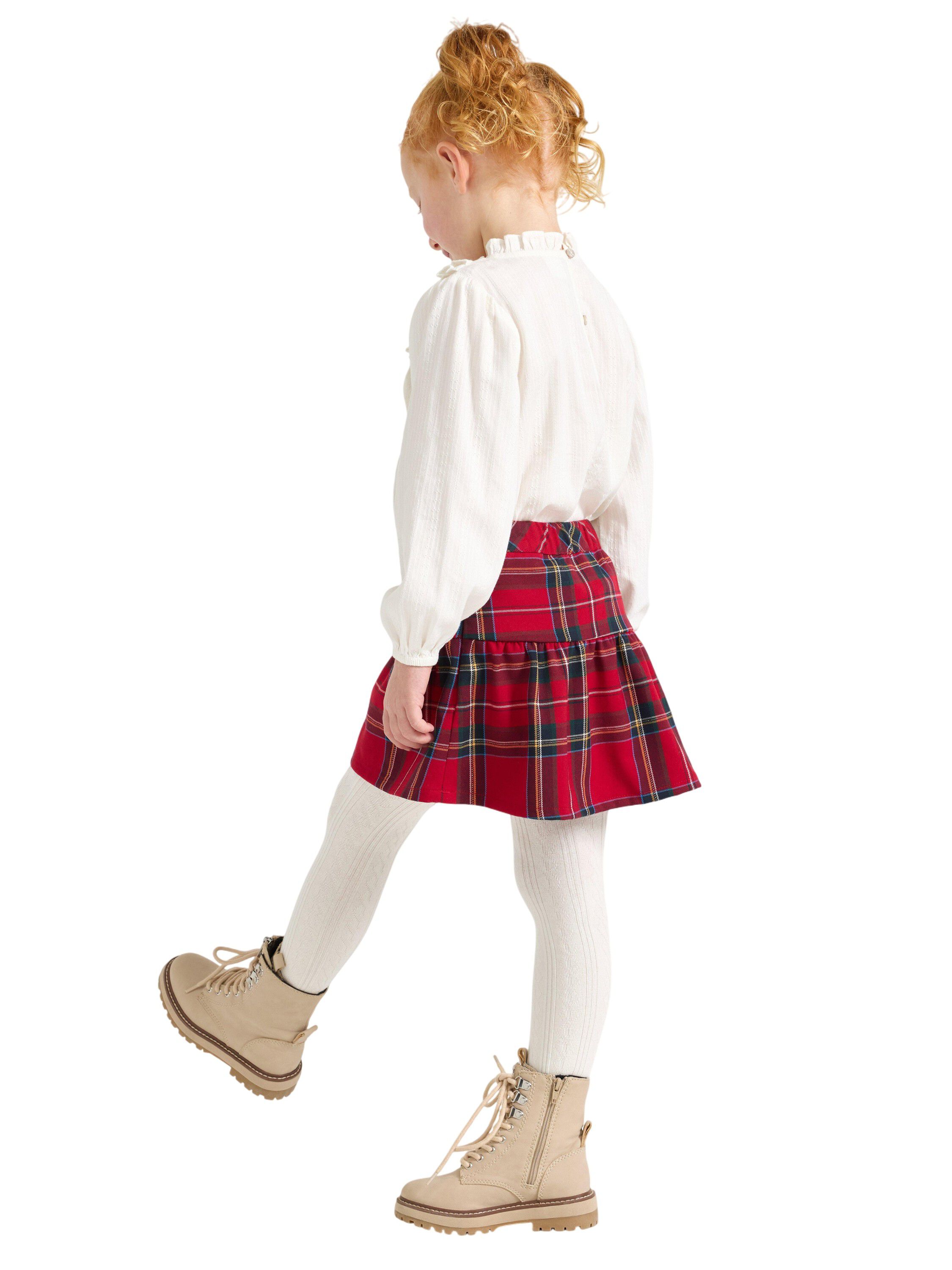 Rutig kjol med res&aring;r i midjan och d