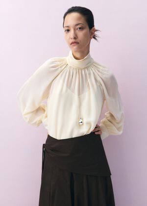Turtleneck ruffled blouse