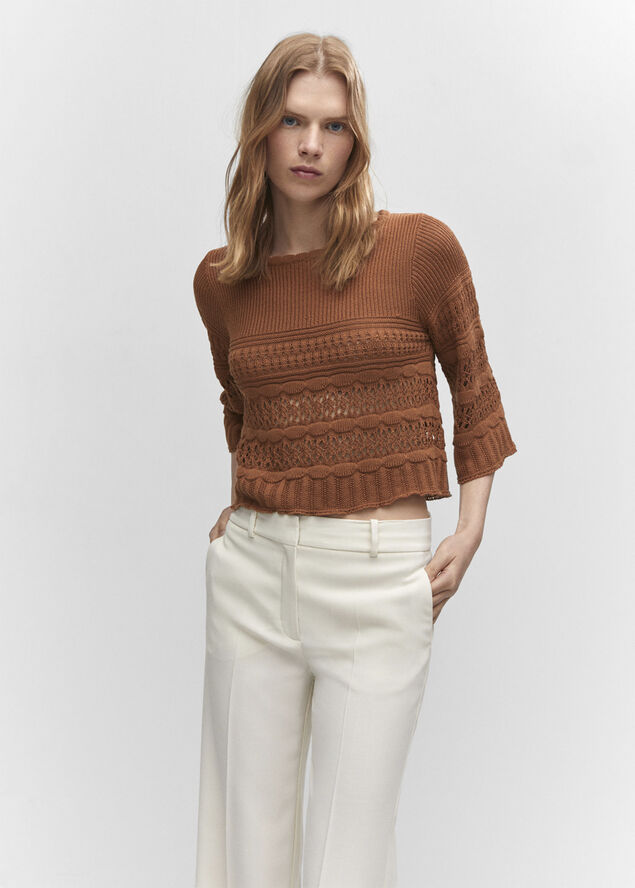Openwork sweater with flared sleeve