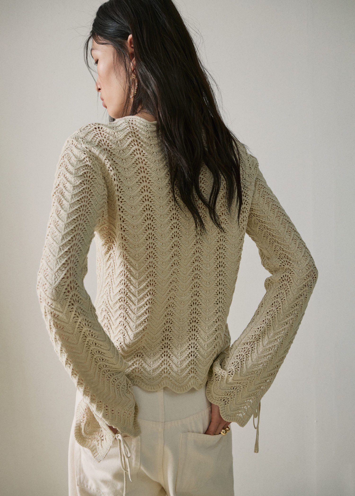 Knitted sweater with openwork detai