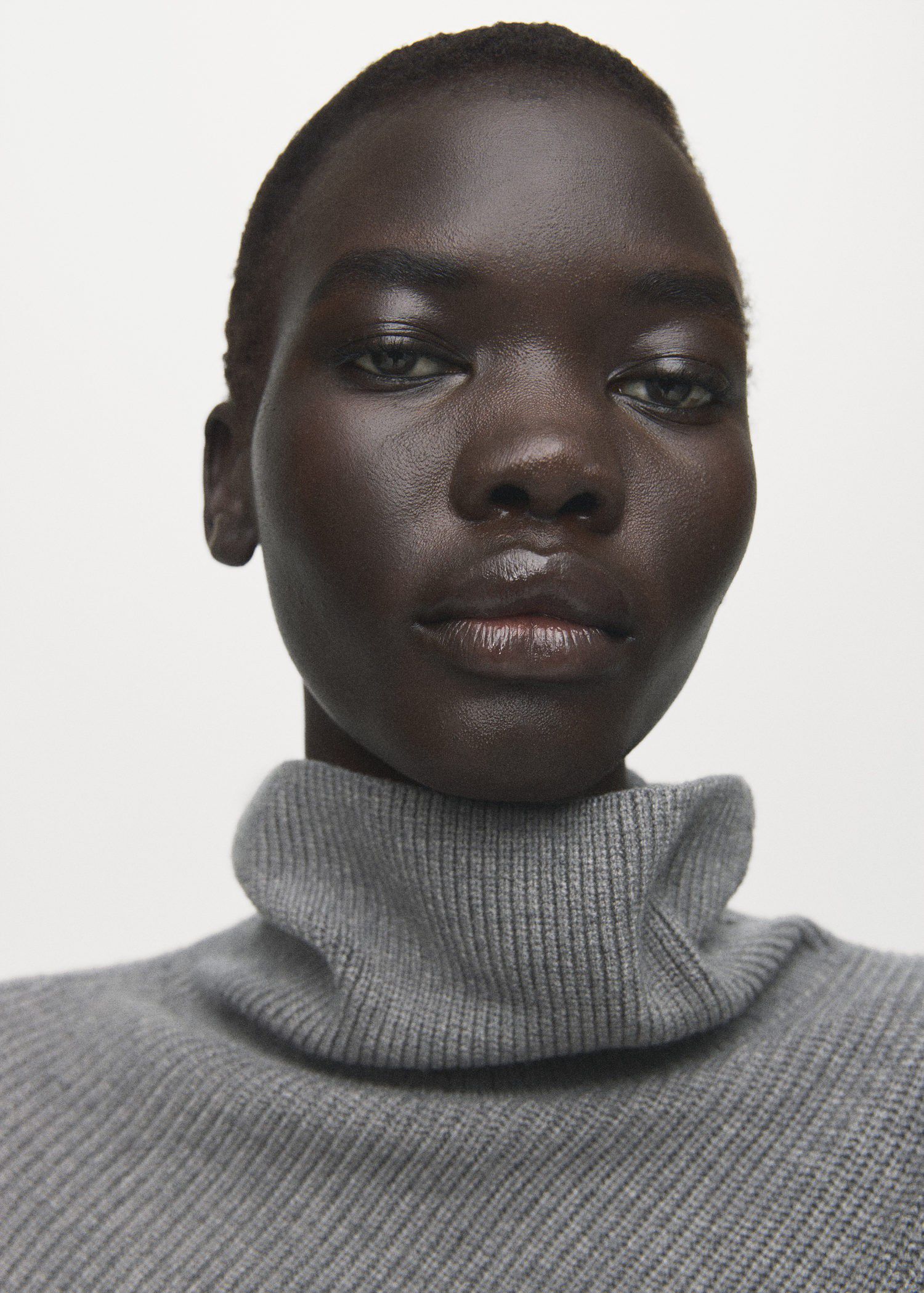 Sweater with asymmetrical roll neck