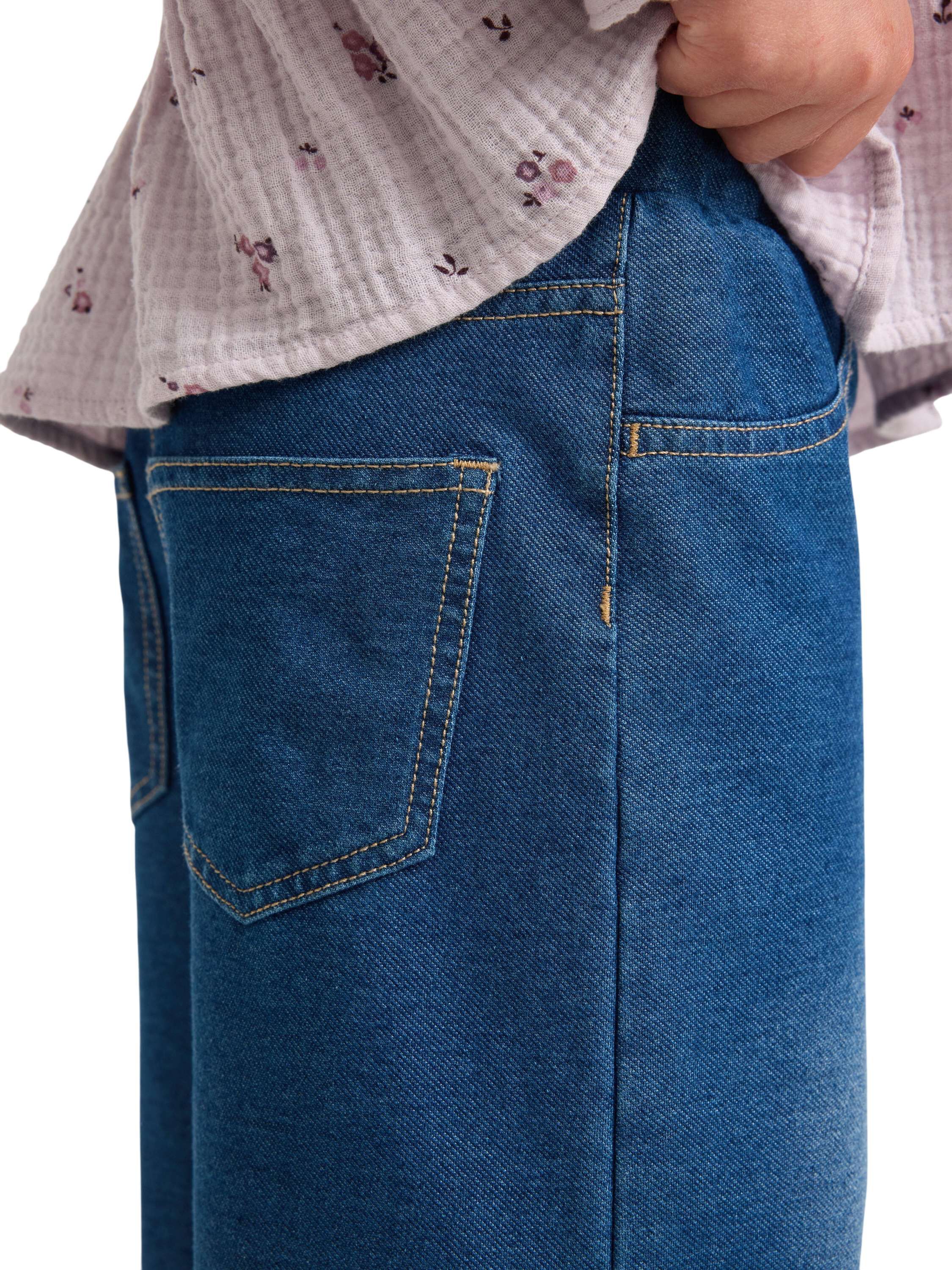 Mjuk byxa i denimtrik&aring; med vida be