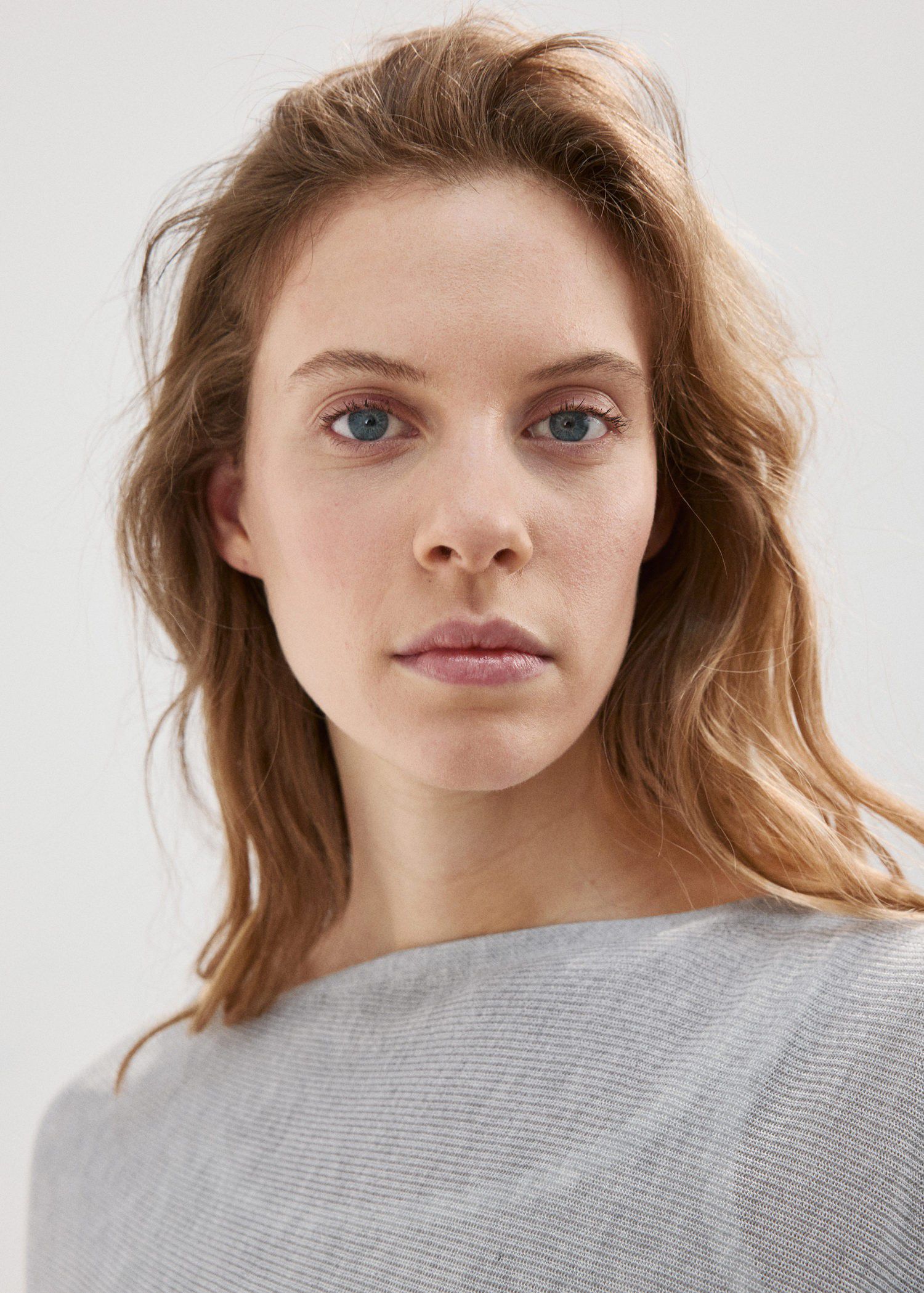 Asymmetrical knitted cape