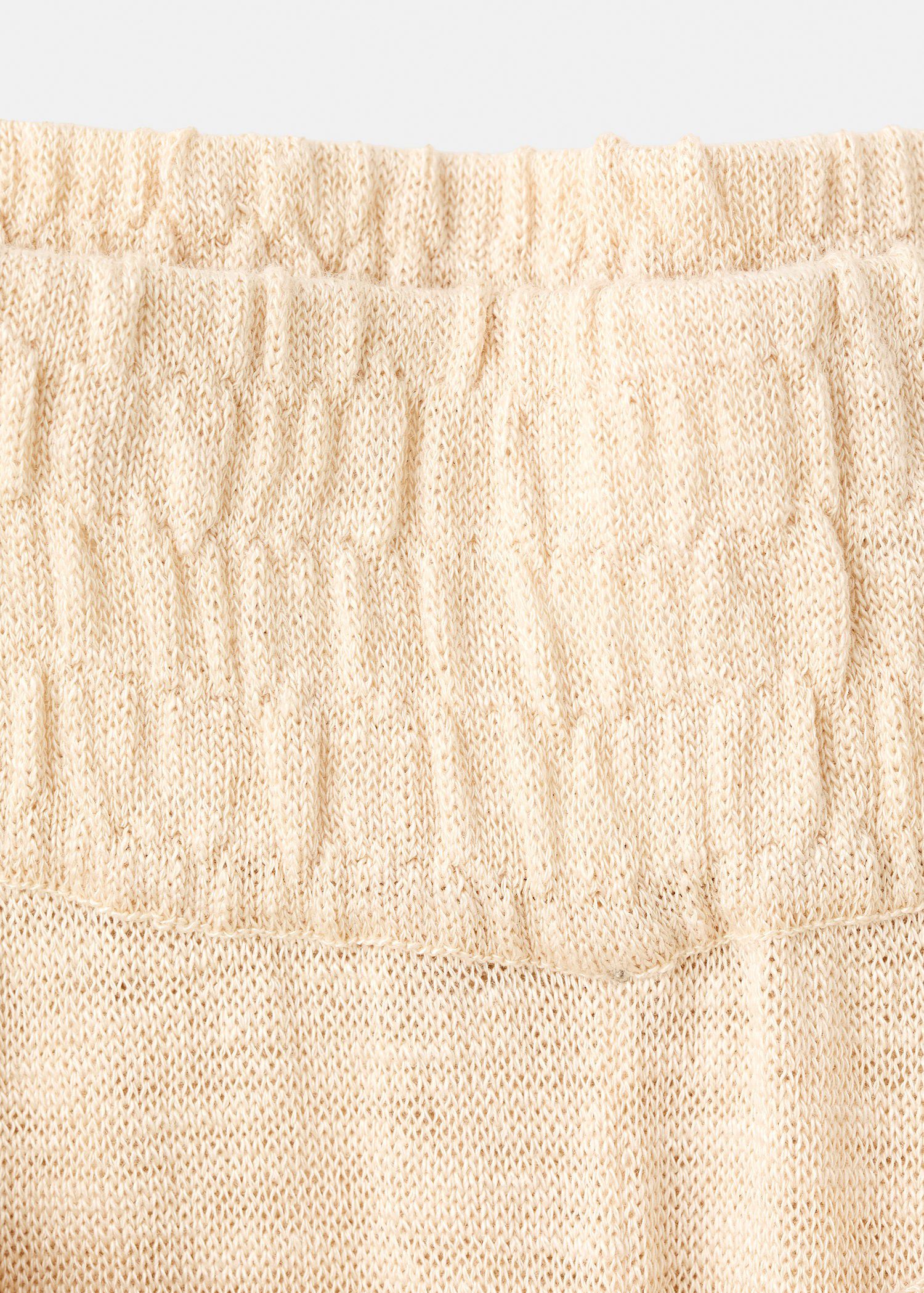 Fine knit trousers with knot detail