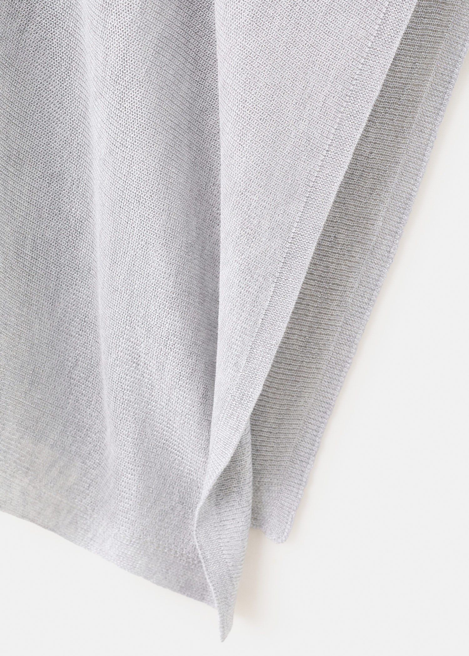 Asymmetrical knitted cape