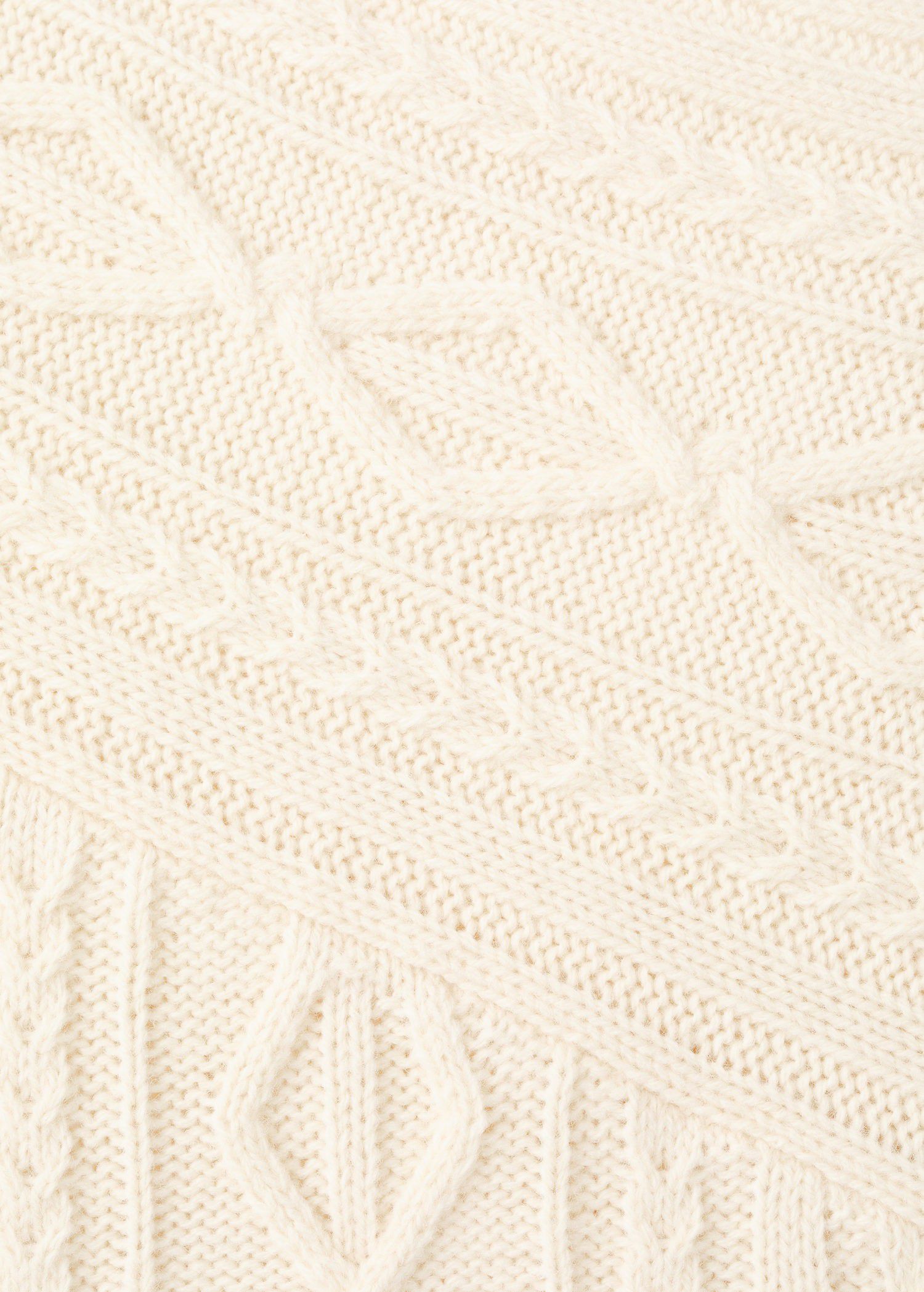 Asymmetrical cable knit sweater