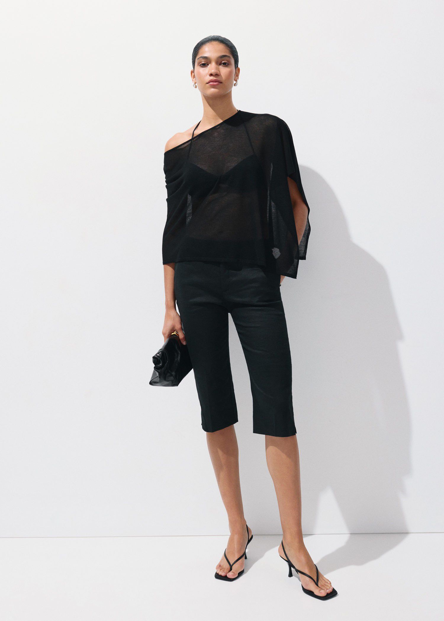 Asymmetrical knitted cape